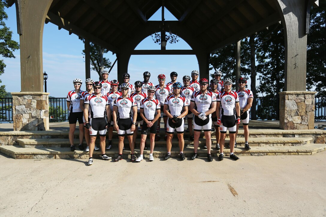 Servicemembers, members of the Gwinnett Sheriffs department, Georgia State Trooper and voluteers pose for a picture after completing the final day of the Operation One Voice Honor Ride, Sept. 7, 2013. Marines with U.S. Marine Corps Forces Special Operations Command were invited to ride in the Honor Ride to support wounded and deceased veteran members of the U.S. Special Operations community.The Honor Ride this year was a 450-mile bike ride over a four day period. (U.S. Marine Corps photo by Sgt. Anthony Carter/Released)