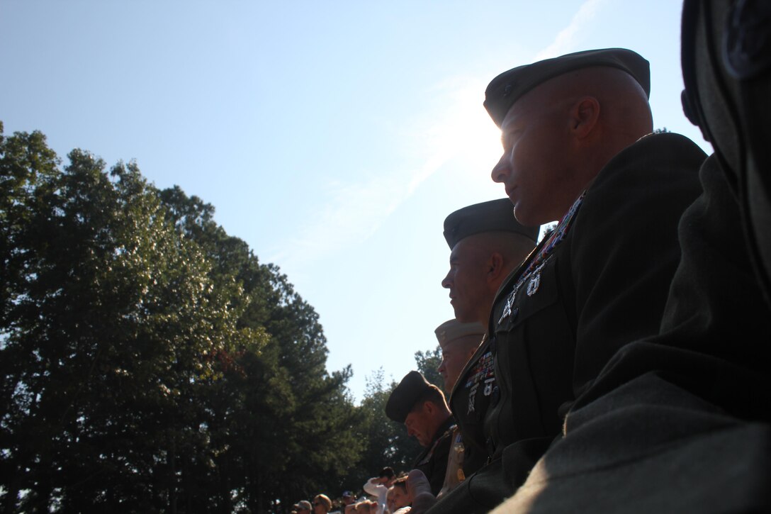 Marines with U.S. Marine Corps Forces Special Operations Command listen during the final ceremony after  completion of the Operation One Voice Honor Ride, Sept. 8, 2013. Marines with MARSOC were invited to ride in the Honor Ride to support wounded and deceased veteran members of the U.S. Special Operations community.The Honor Ride this year was a 450-mile bike ride over a four day period. (U.S. Marine Corps courtesy photo/Released)