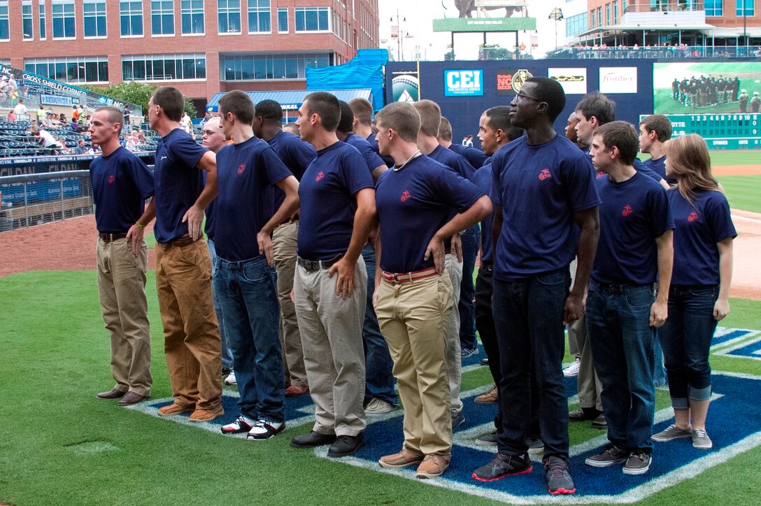 Marine Corps Poolees of Recruiting Sub-Station Durham, stand in formation during an oath of enlistment ceremony at the Durham Bull Athletic Park in Durham, N.C., August 21, 2013. Poolees of RSS Durham took their oath of enlistment in front of Durham Bulls fans before the game. (U.S. Marine Corps photo by Sgt. Dwight A. Henderson/Released)