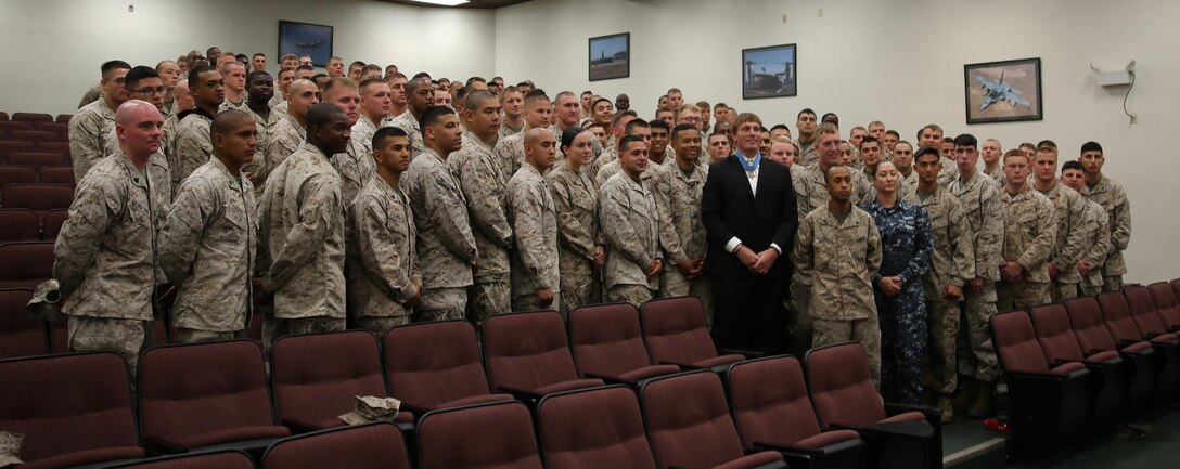 Sgt. Dakota Meyer, Medal of Honor recipient, poses for a photo with Marines and Sailors from the 3rd Marine Aircraft Wing after a leadership symposium in the MCAS Miramar station auditorium, Sept. 11.