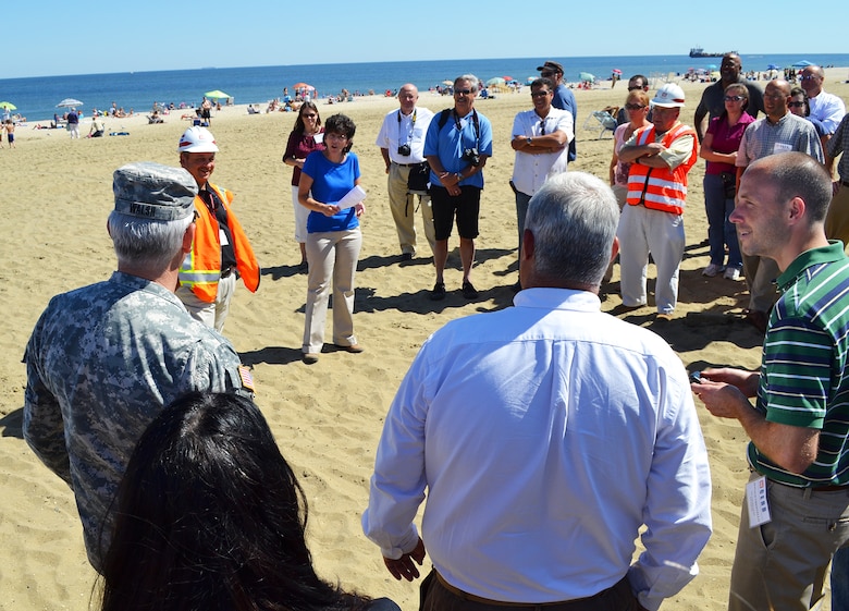 At Sea Bright, New Jersey, Lynn Bocamazo of New York District speaks with Maj. Gen. Michael Walsh, the Army Corps’ Deputy Commanding General for Civil and Emergency Operations during a group visit to the northern most part of the beach nourishment project.  Discussed was what occurred during Sandy and areas exposed to tidal flooding from the Shrewsbury River on the backside of the Borough.