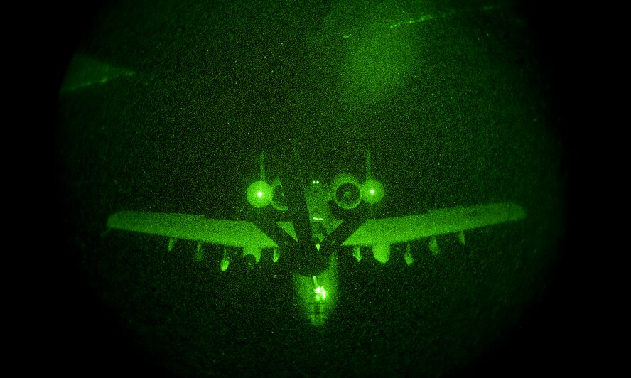 An A-10 Thunderbolt II, from Davis-Monthan Air Force Base, Ariz., approaches the boom of a KC-135 Stratotanker from McConnell Air Force Base, Kan., for refueling Sept. 12, 2013 over southern Arizona. The night flight was used as a training mission not only for the pilot of the A-10 but also for the boom operater on board the KC-135. (U.S. Air Force photo/Airman 1st Class Colby L. Hardin)
