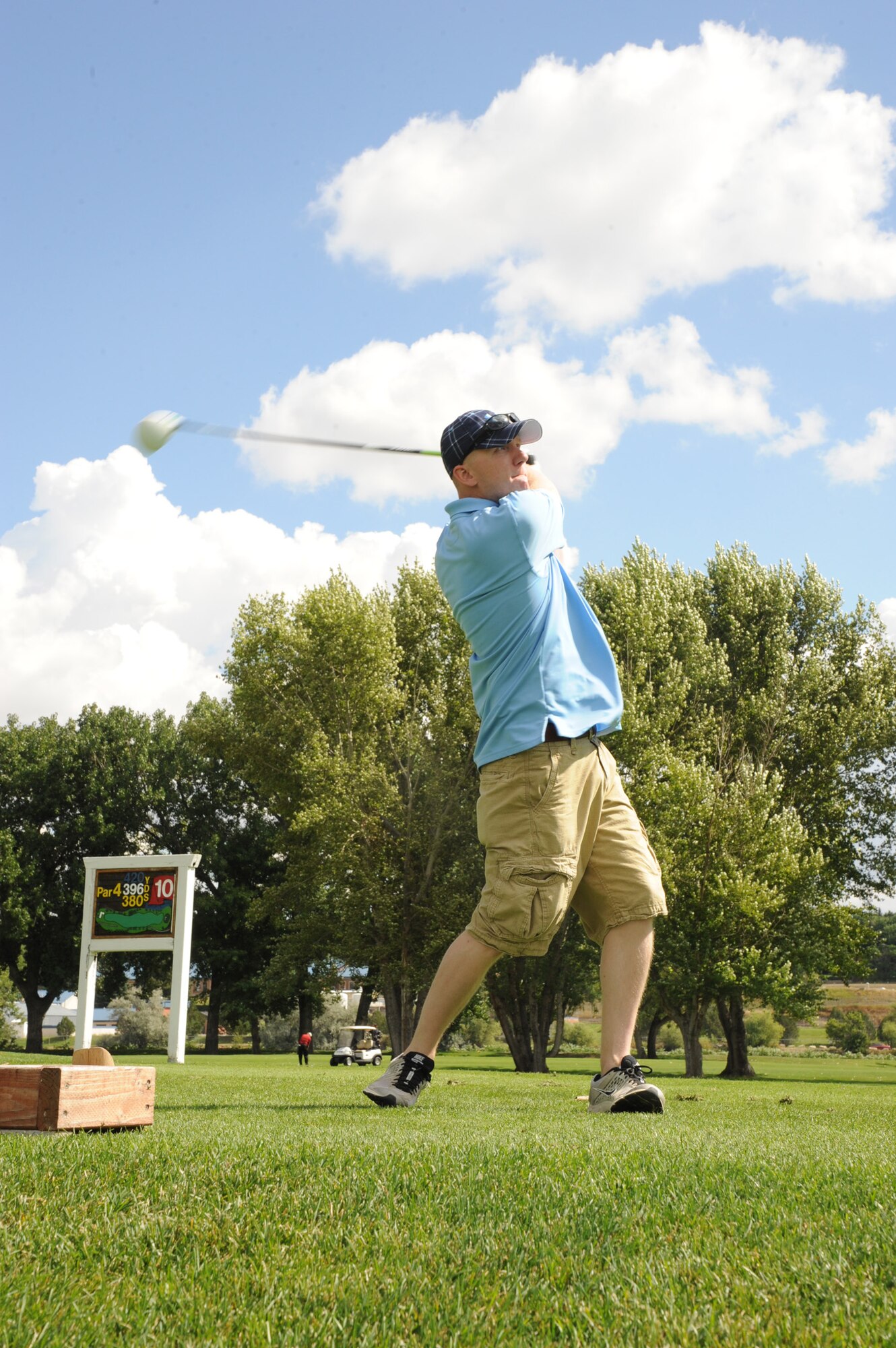 1st Lt. Camerand Ersch, 341st Maintenance Operations Squadron flight commander, tees off at the tenth hole during the Annual Military Affairs Committee Golferoo in Great Falls on Sept. 9. The Golferoo was an opportunity for Team Malmstrom members to golf at Meadow Lark Country Club without a membership and interact with MAC members of the Great Falls community. (U.S. Air Force photo/Senior Airman Katrina Heikkinen)