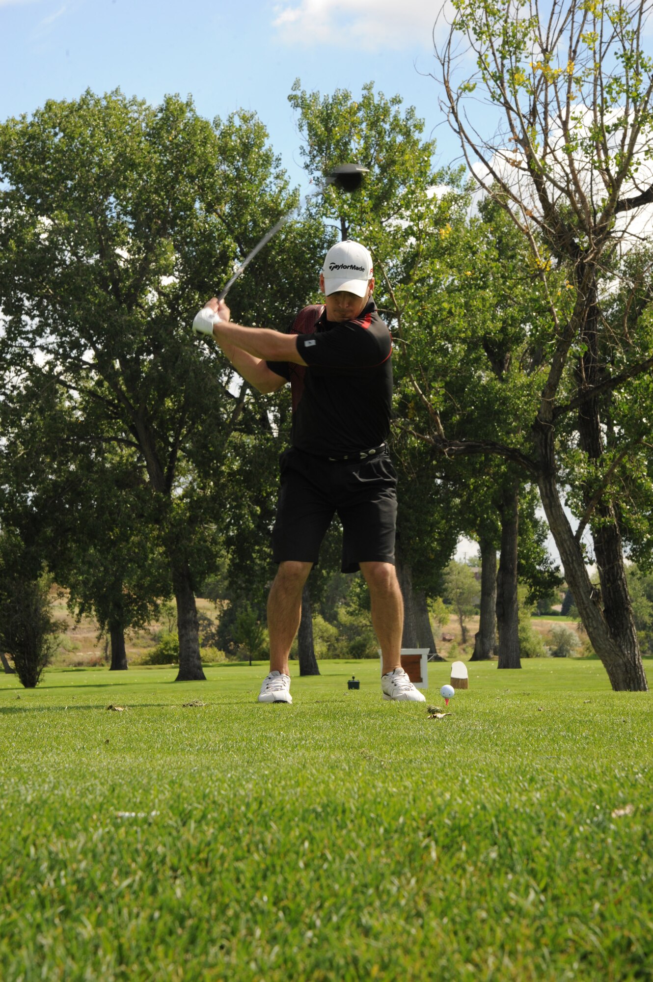 Col. Robert Stanley, 341st Missile Wing commander, puts his iron into his golf bag during the first hole at Meadow Lark Country Club in Great Falls, Mont., on Sept. 9. Stanley participated in the 38th Annual Great Falls Area Chamber of Commerce Military Affairs Committee Golferoo. (U.S. Air Force photo/Senior Airman Katrina Heikkinen)