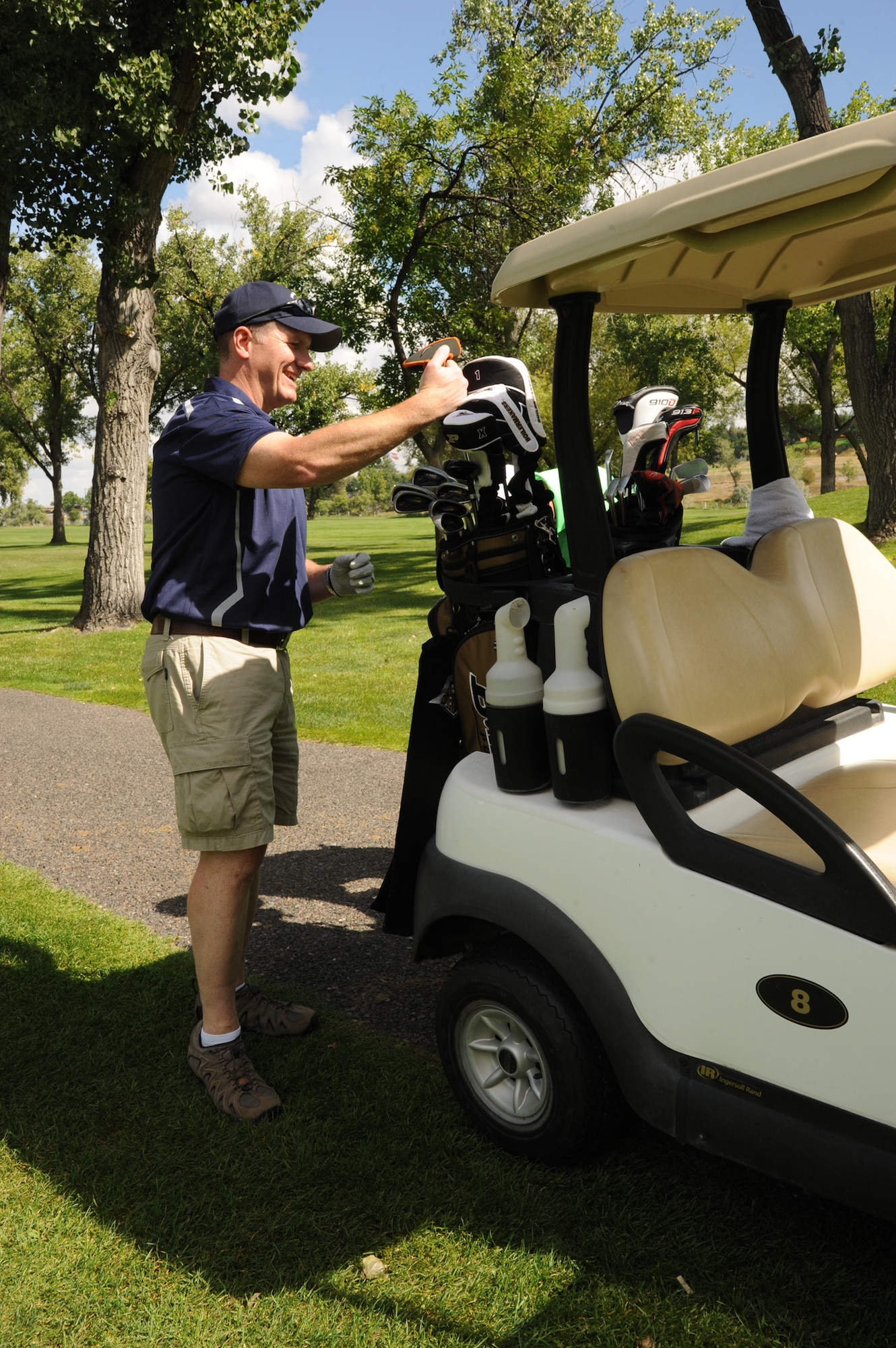 Col. Robert Stanley, 341st Missile Wing commander, puts his iron into his golf bag during the first hole at Meadow Lark Country Club in Great Falls, Mont., on Sept. 9. Stanley participated in the 38th Annual Great Falls Area Chamber of Commerce Military Affairs Committee Golferoo. (U.S. Air Force photo/Senior Airman Katrina Heikkinen)