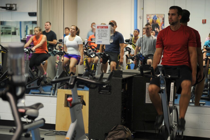 David Friedrich, Davis-Monthan Health and Wellness Center health and fitness specialist, monitors participants of his High Intensity Interval Training class during a rest period at Davis-Monthan Air Force Base, Ariz., Sept. 10, 2013. The HAWC offers more than 17 free fitness classes for anyone with access to the base. (U.S. Air Force photo by Staff Sgt. Courtney Richardson/Released) (Cropped)