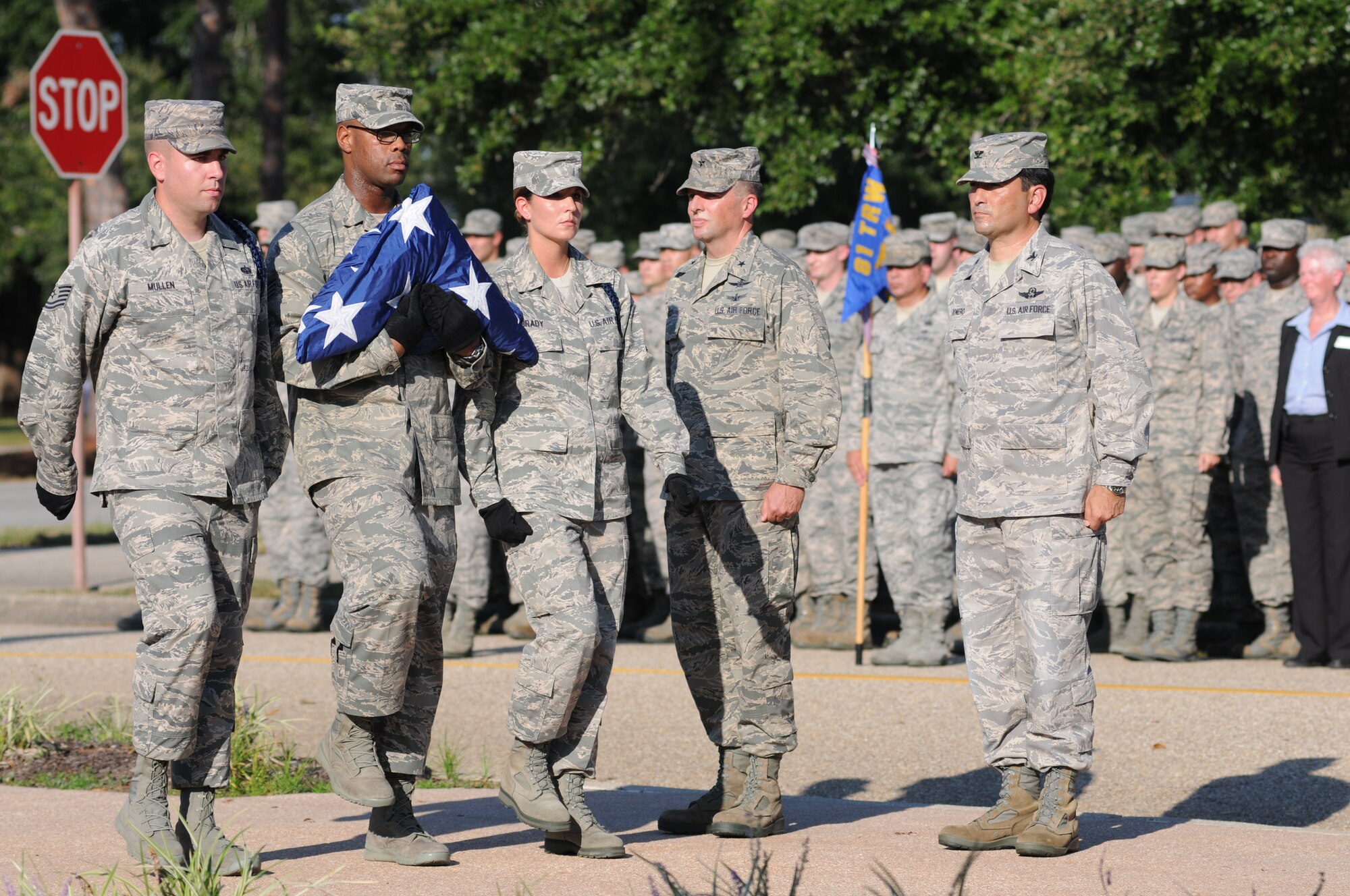 Tech. Sgt. Kyle Mullen, 81st Training Group military training leader, and Staff Sgts. Issac Kendrick, 336th Training Squadron MTL, and Victoria Brady, 338th Training Squadron MTL, complete a flag folding ceremony during a retreat ceremony Sept. 11, 2013, Keesler Air Force Base, Miss. The ceremony honored those who lost their lives during the 9/11 attacks.  (U.S. Air Force photo by Kemberly Groue)