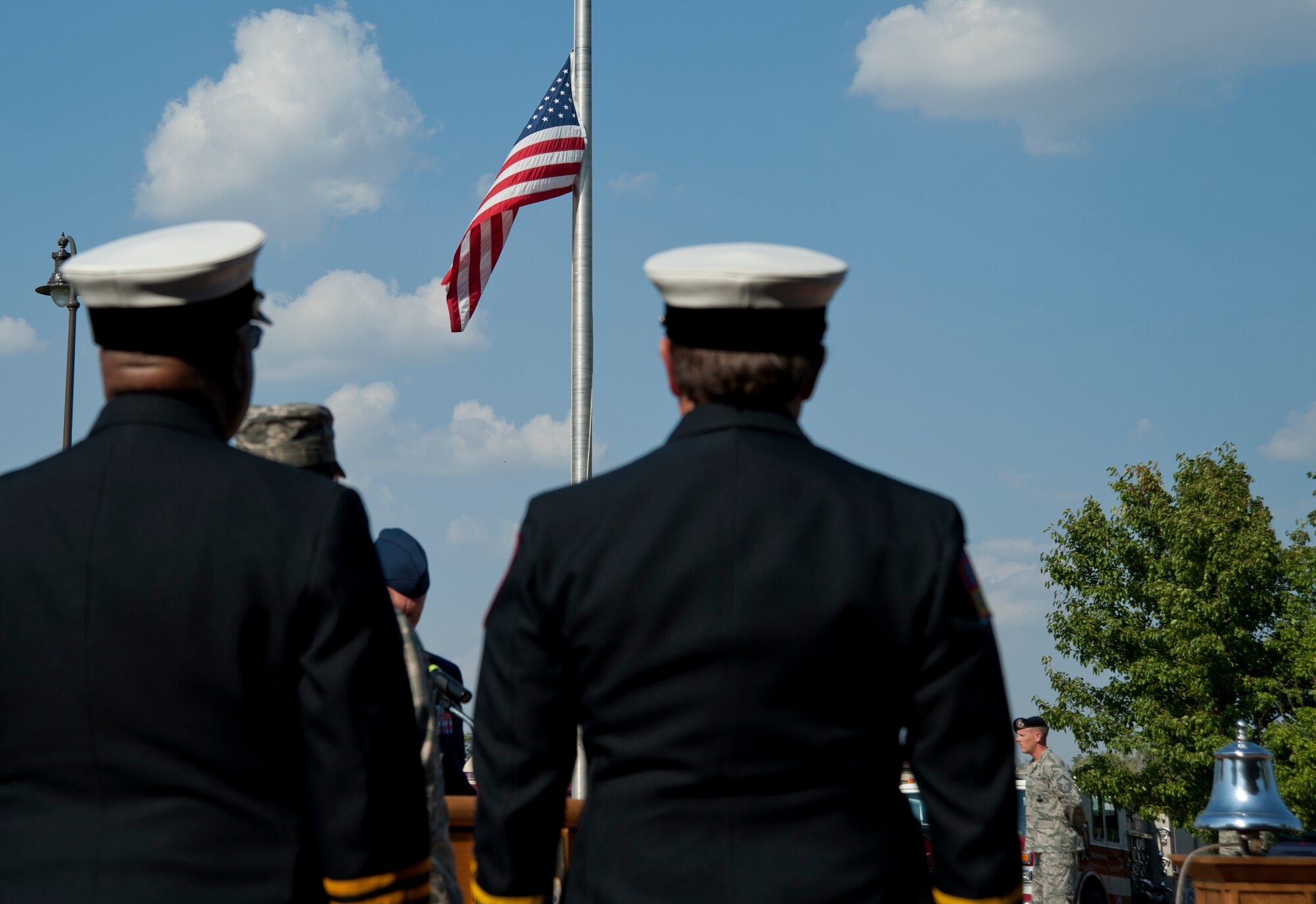 Members of local fire stations stand at attention during a Patriot Day ceremony Sept. 11, 2013, at McConnell Air Force Base, Kan. The ceremony was held in honor of the nearly 3,000 people who died during the 9/11 attacks. (U.S. Air Force photo/Airman 1st Class Victor J. Caputo)