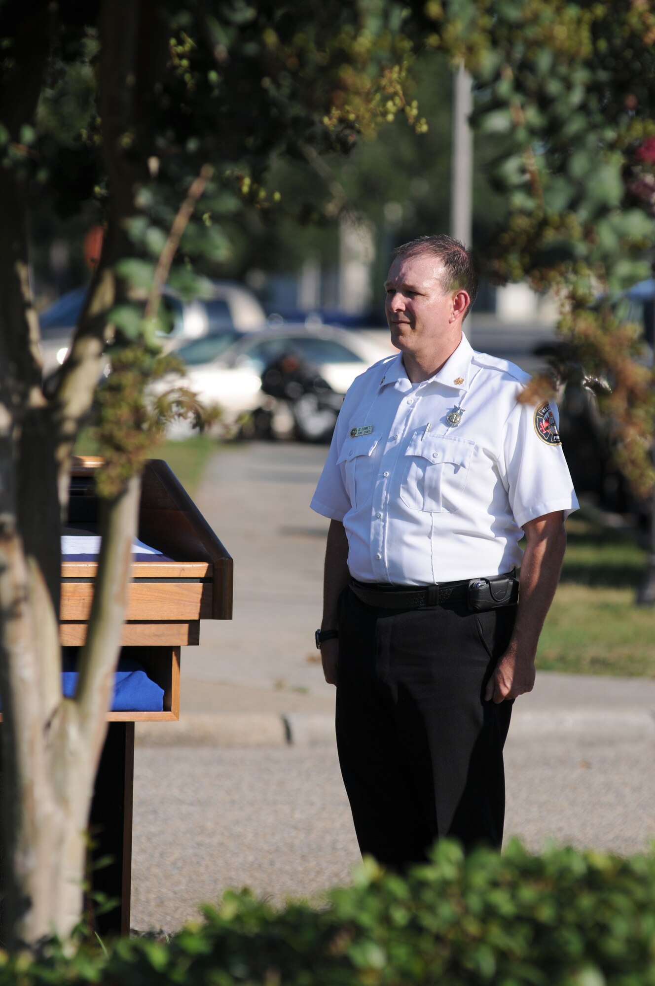 Chief James Donnett, Keesler Fire Department, stands at attention during a retreat ceremony Sept. 11, 2013, Keesler Air Force Base, Miss. The ceremony honored those who lost their lives during the 9/11 attacks.  (U.S. Air Force photo by Kemberly Groue)
