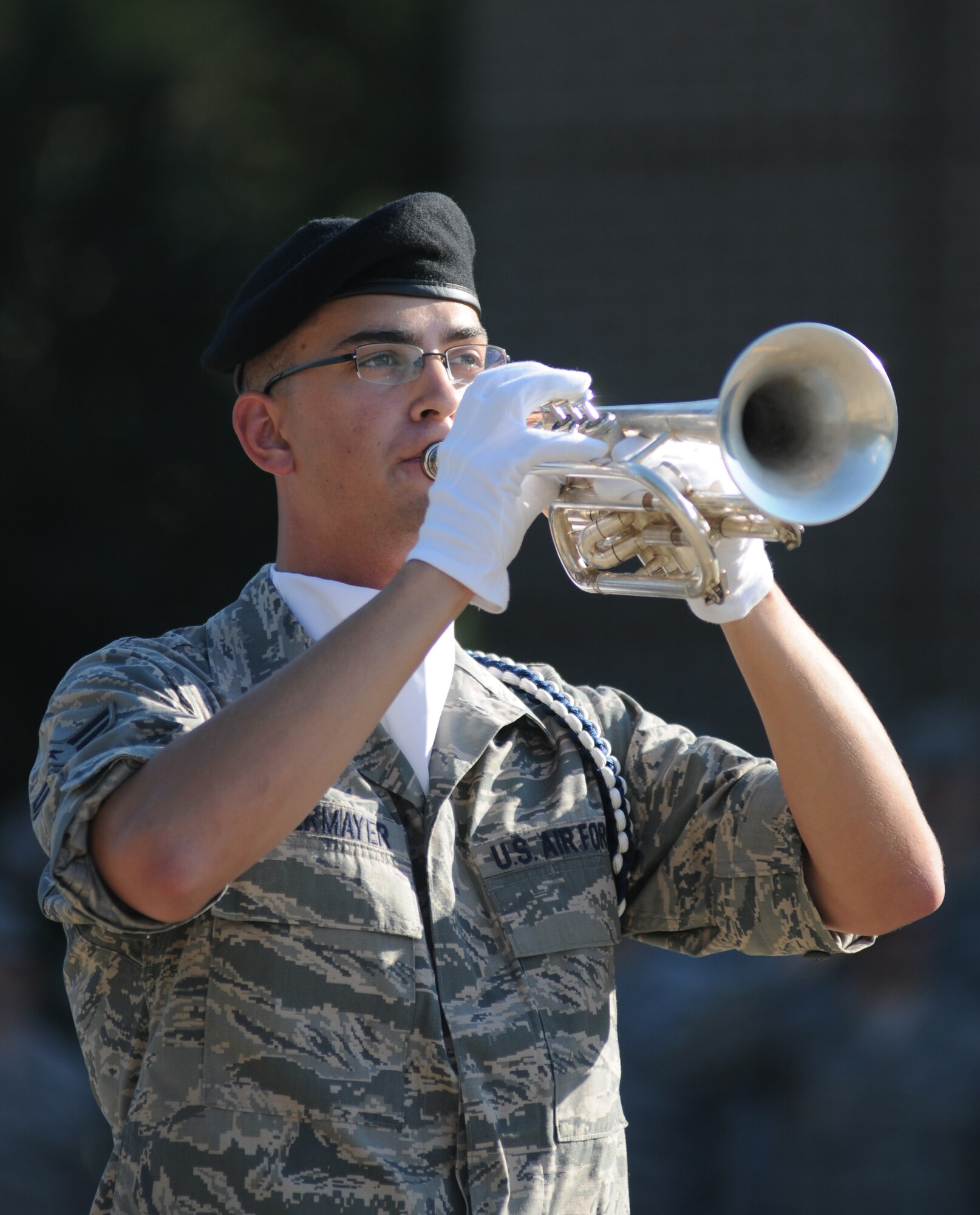 Airman 1st Class Christopher Lamermayer, 338th Training Squadron and member of the Keesler Drum and Bugle Corps., plays taps during a retreat ceremony Sept. 11, 2013, Keesler Air Force Base, Miss. The ceremony honored those who lost their lives during the 9/11 attacks.  (U.S. Air Force photo by Kemberly Groue)