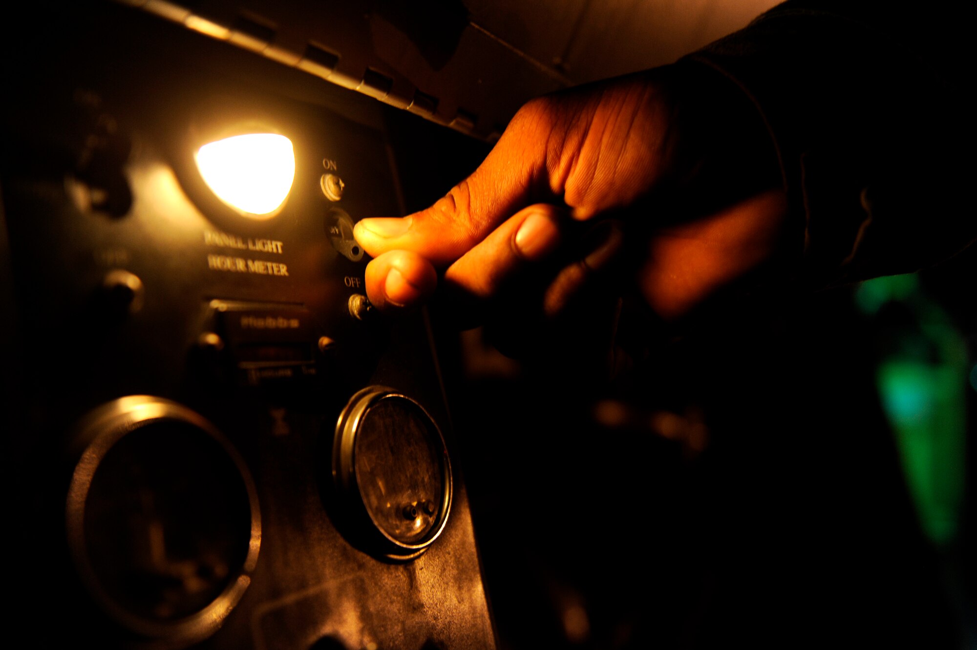 A U.S. Air Force Airman from the 18th Component Maintenance Squadron starts a portable flood light during a local operational readiness exercise on Kadena Air Base, Japan, Sept. 12, 2013. Kadena Airmen regularly conduct LOREs to improve their capabilities in support of the common defense of the Asia-Pacific region. (U.S. Air Force photo by Senior Airman Maeson L. Elleman)