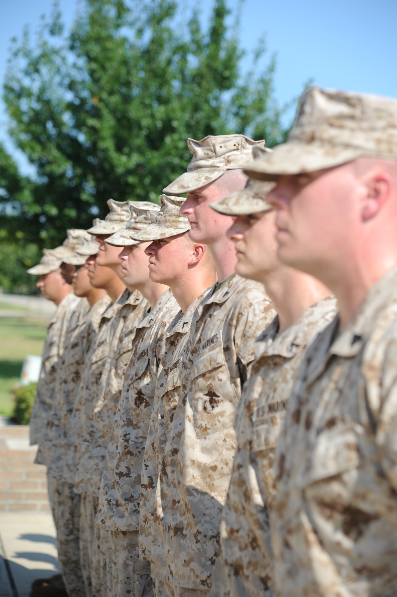 Members of the Keesler Marine Corps Detachment stand at attention during a Sept. 11, 2013, ceremony performed by The Center for Naval Aviation Technical Training Unit, Keesler Air Force Base, Miss., to honor those who have given their lives since 9/11.  (U.S. Air Force photo by Kemberly Groue)