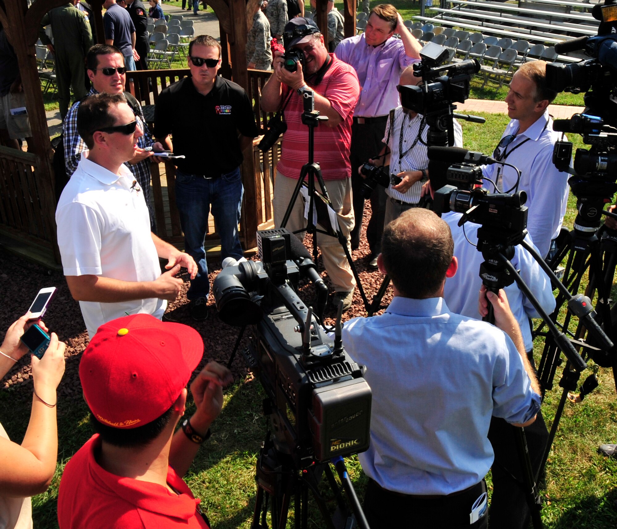 Kyle Busch, NASCAR Sprint Cup Series driver, answers questions from media members during his visit to Team Dover Sept. 11, 2013, at the Air Mobility Command Museum on Dover Air Force Base, Del. Busch attended the unveiling of the Sept. 11 Memorial as part of his visit. (U.S. Air Force photo/Tech. Sgt. Chuck Walker)