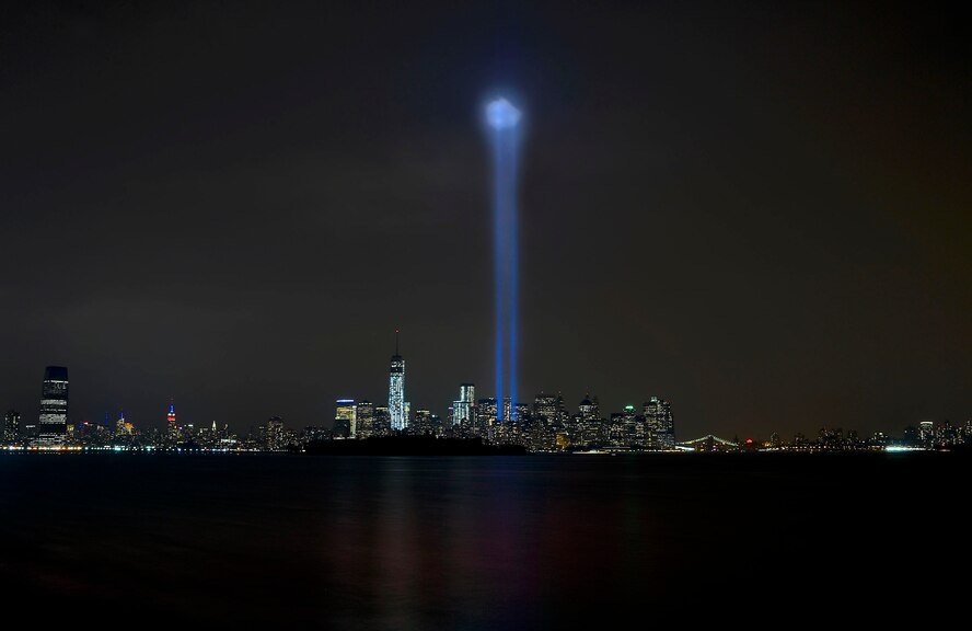 New York city's lower Manhattan skyline and the newly completed One World Trade Center Building is illuminated by two beams of light representing the remembrance of the Citizen Americans lost on Sept. 11, 2001.  (U.S. Air Force photo/David Tucker)