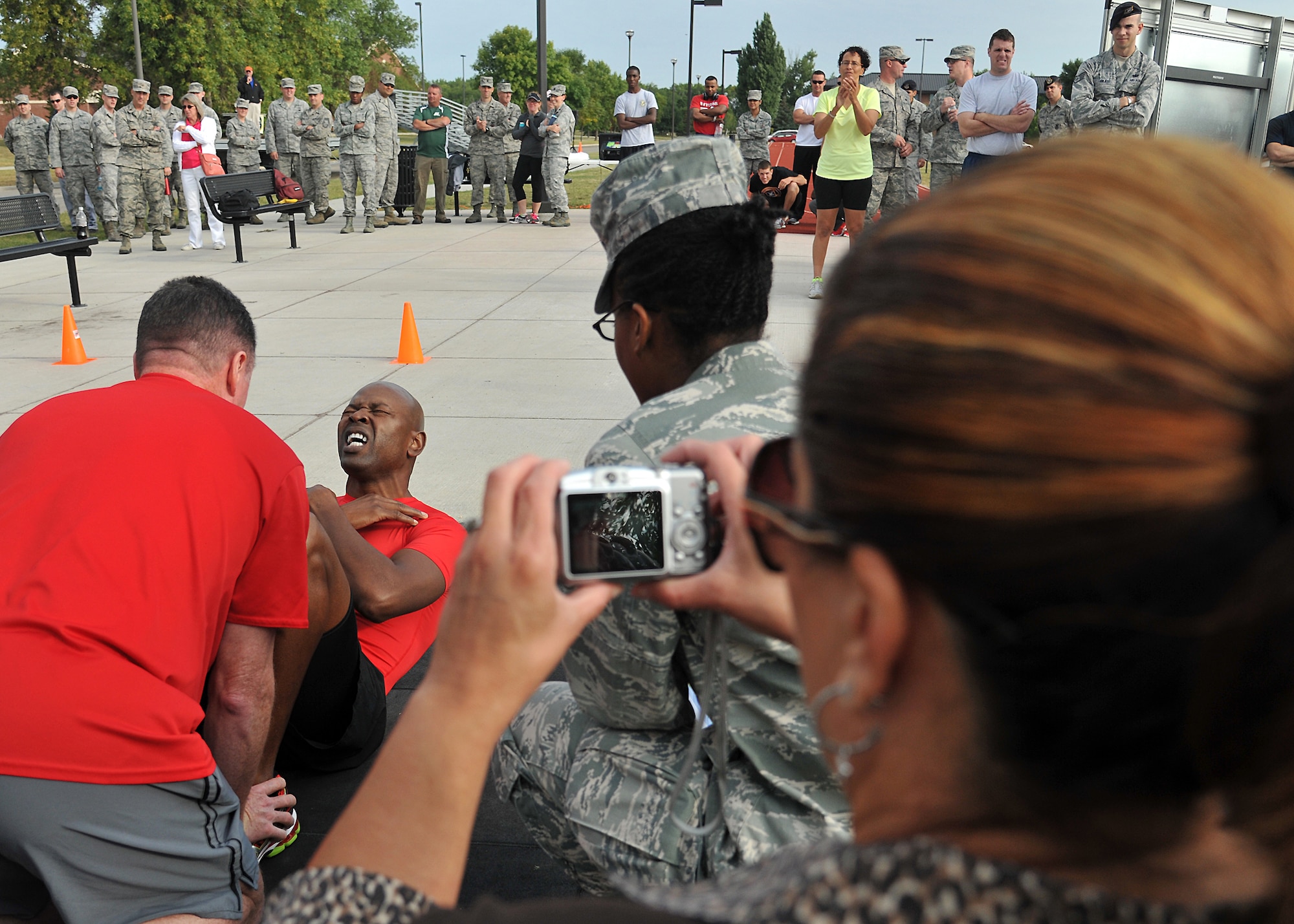 Col. Joe Lindsey, 319th Mission Support Group commander, performs a sit-up during the Triple 8 Fitness Challenge event at the base outdoor running track on Grand Forks Air Force Base, N.D., on Sept. 5, 2013. The Triple 8 Fitness Challenge is a premier fitness event designed to test the conditioning limits of Air Force athletes and to distinguish an elite group that sets the fitness standard. (U.S. Air Force photo/ Senior Airman Xavier Navarro)