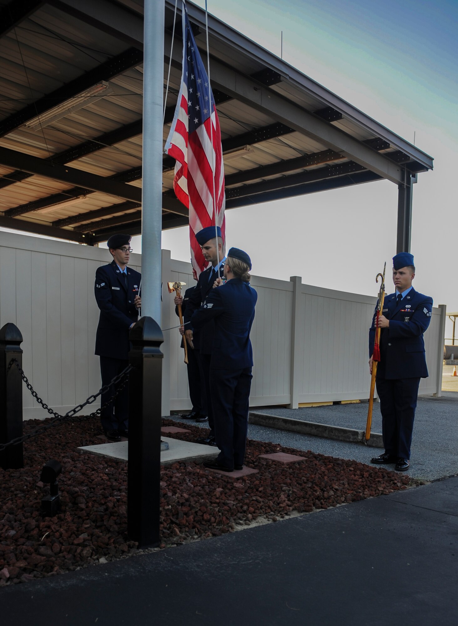 Airmen raise the flag to half-staff at the Moody Air Force Base, Ga., fire department Sept. 11, 2013. A total of 2,945 Americans lost their lives Sept. 11, 2001, with 343 of them being emergency responders and 60 being port authority New York police officers. (U.S. Air Force photo by Airman Alexis Grotz/Released)
