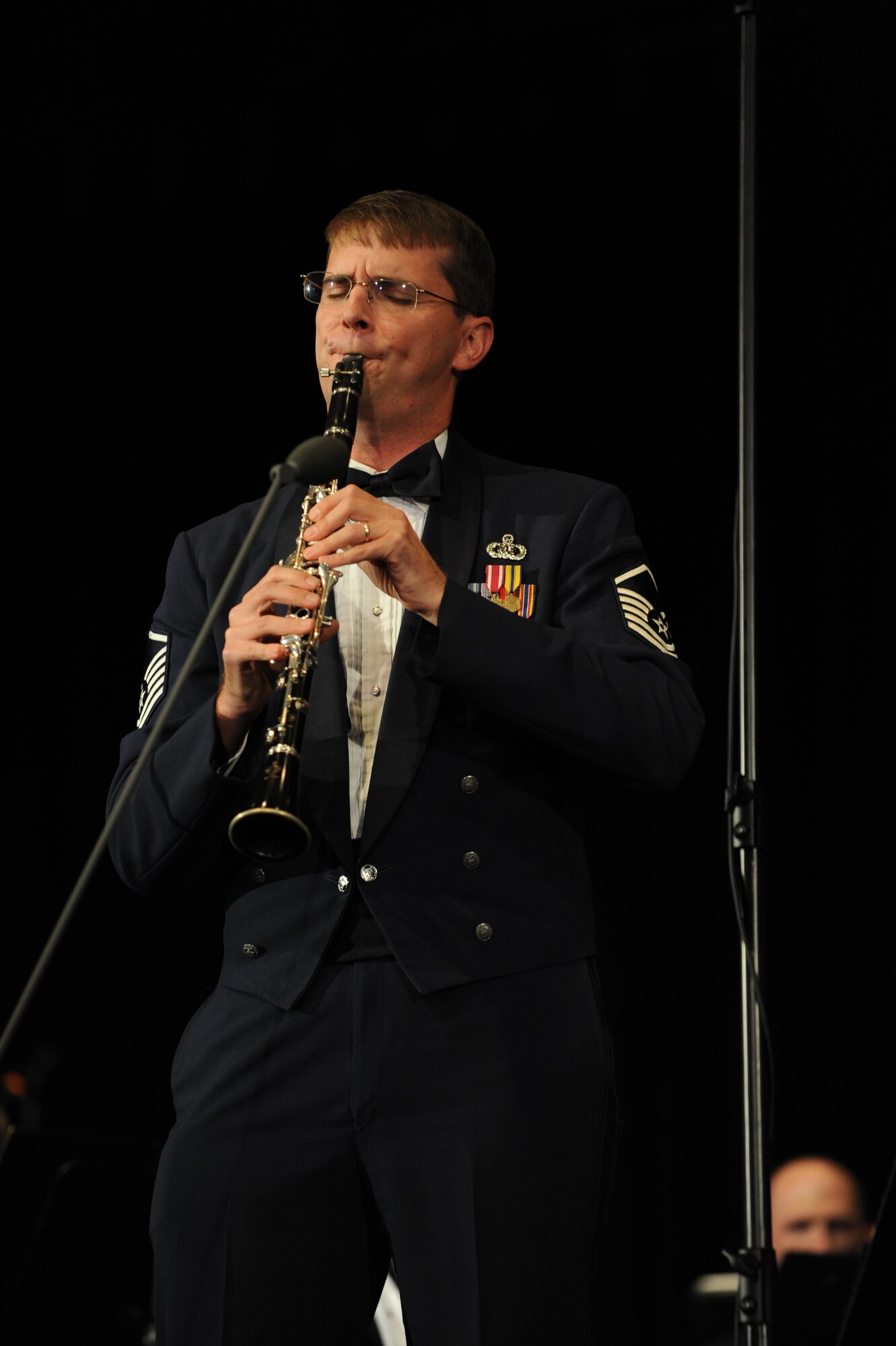 Concert Band programming flight manager and clarinetist, Master Sgt. Brian
McCurdy solos with the Concert Band prior to his recent promotion. (A.F.
photo)