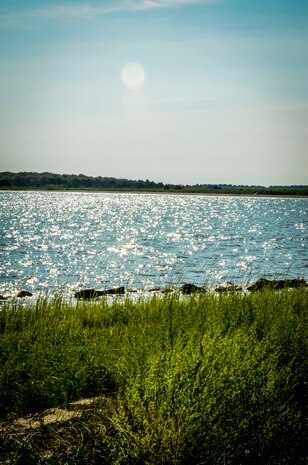 Volunteers from Joint Base Charleston wrap up a morning of volunteering  Sept. 6, 2013, at the Fort Johnson Oyster Reef Center in Charleston, S.C. Approximately 2,500 service members from JB Charleston participated in the Trident United Way’s Day of Caring, volunteering their skills to assist with more than 50 projects in the local community. (U.S. Air Force Photo/ 2nd Lt. Alexandra Trobe)