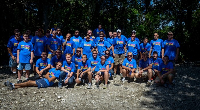 Volunteers from Joint Base Charleston wrap up a morning of volunteering  Sept. 6, 2013, at the Fort Johnson Oyster Reef Center in Charleston, S.C. Approximately 2,500 service members from JB Charleston participated in the Trident United Way’s Day of Caring, volunteering their skills to assist with more than 50 projects in the local community. (U.S. Air Force Photo/ 2nd Lt. Alexandra Trobe)