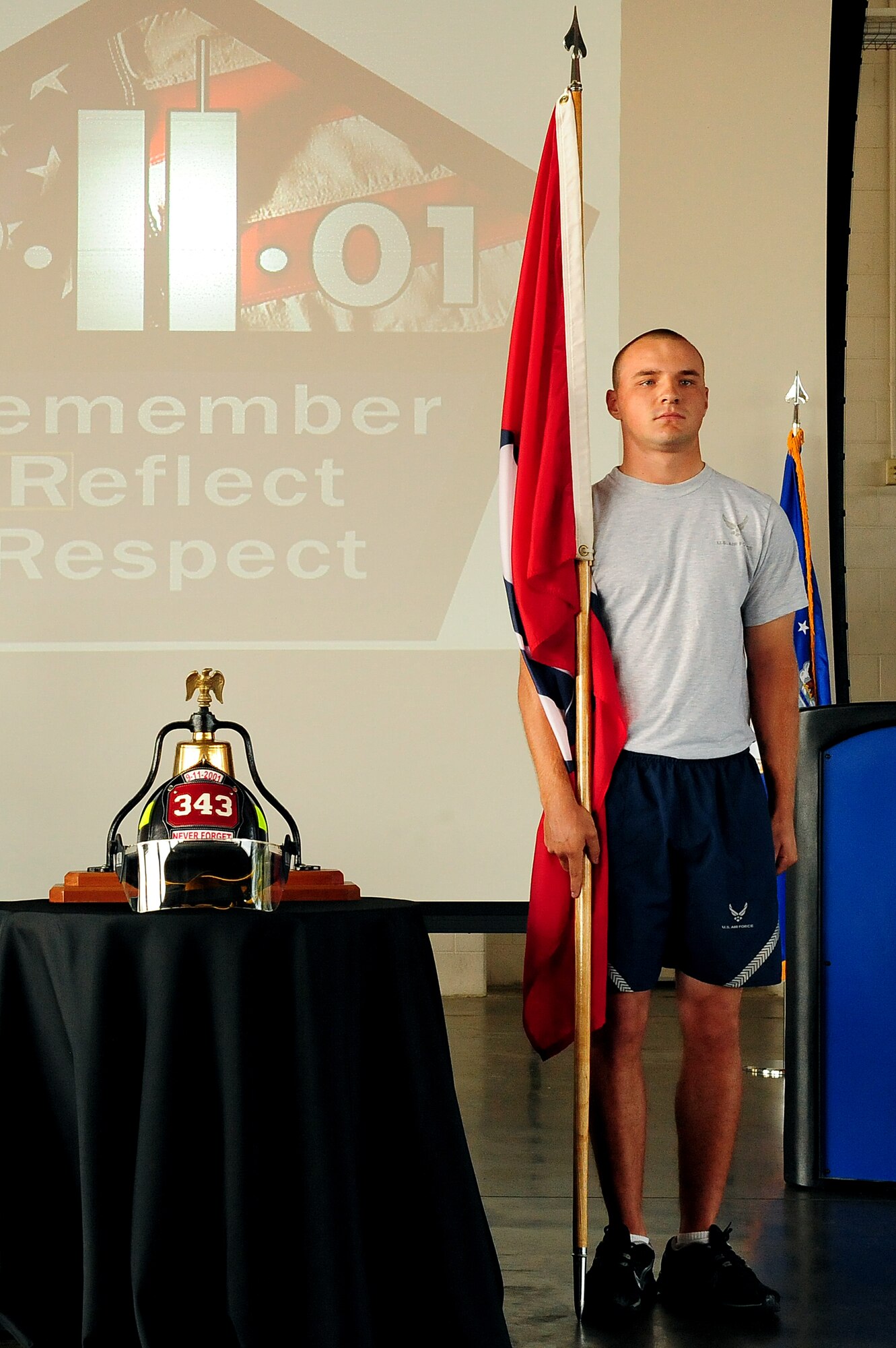 U.S. Air Force Airman 1st Class, David Kravies, 4th Civil Engineer Squadron firefighter, waits for the cue to start a 24-hour run during a 9/11 memorial ceremony at Seymour Johnson Air Force Base, N.C., Sept. 11, 2013.  4th CES firefighters carried the memorial flag throughout the run to pay tribute to those who lost their lives during the attacks of 9/11.  (U.S. Air Force photo by Airman 1st Class Brittain Crolley)