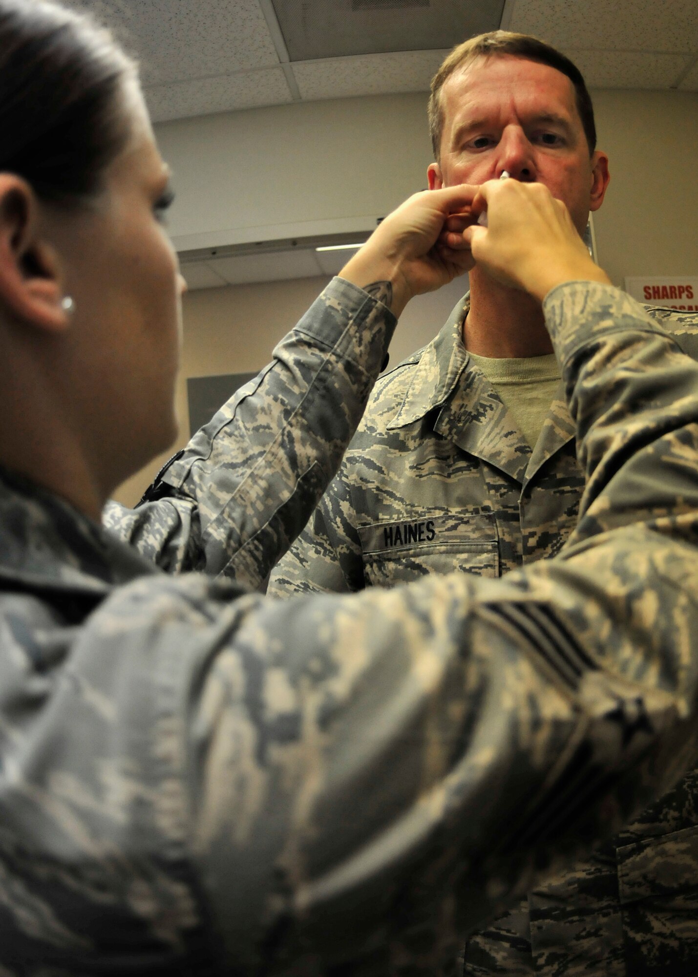 Senior Airman Meagan Hamilton, from the 919th Medical Squadron, provides the flu mist to Master Sgt. Donald Haines, from the 919th Maintenance Squadron, at Duke Field, Fla., Sept 7.  Base personnel received their annual vaccinations during the unit training assembly.  (U.S. Air Force photo/Tech. Sgt. Jasmin Taylor)