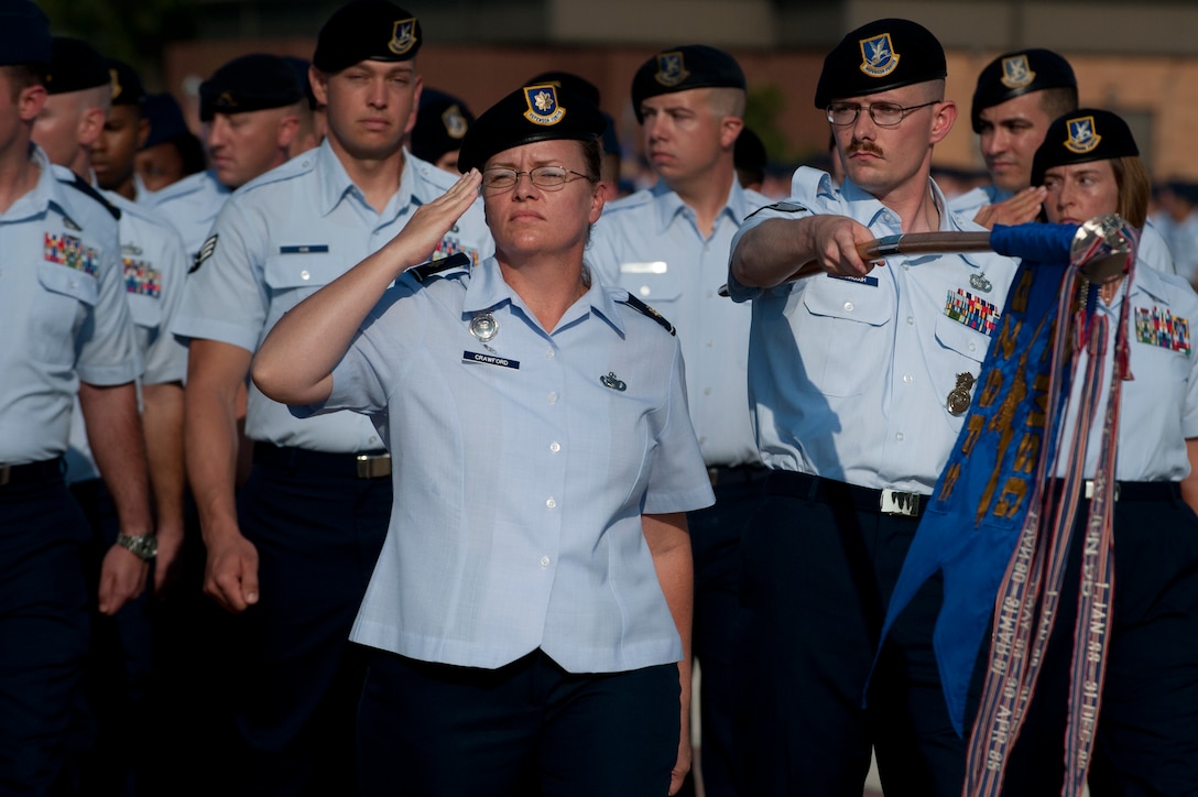 Maj, Kim Crawford, 82nd Security Forces Squadron commander, leads the squadron during pass and review at the change of command ceremony Sept. 12, 2013. Brig. Gen. Scott Kindsvater took command of the largest technical training base from Brig. Gen. Michael Fantini. Maj. Gen. Leonard Patrick, 2nd Air Force commander, presided over the ceremony.  (U.S. Air Force photo/Staff Sgt. Mike Meares) 