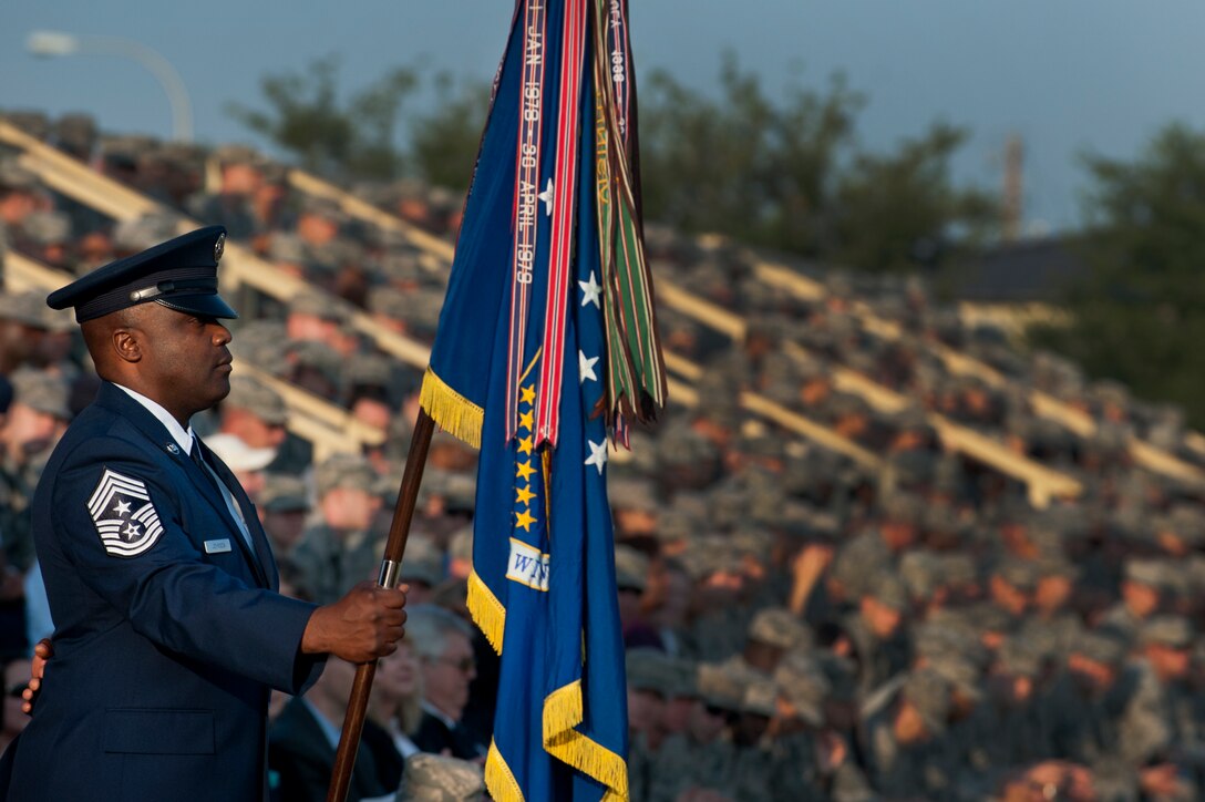 Chief Master Sgt. Eric Johnson, 82nd Training Wing command chief master sergeant, holds the wing guidon during the change of command ceremony Sept. 12, 2013. Brig. Gen. Scott Kindsvater took command of the largest technical training base from Brig. Gen. Michael Fantini. (U.S. Air Force photo/Staff Sgt. Mike Meares) 