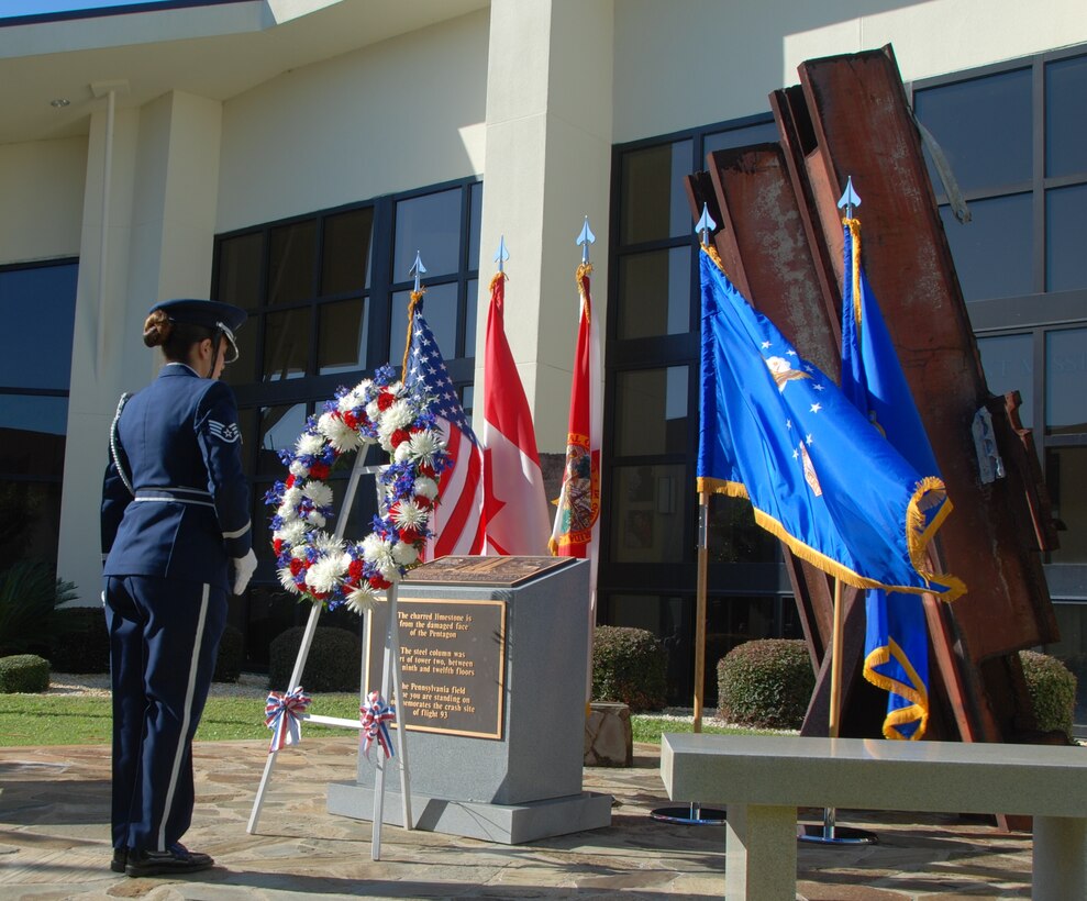 U.S. Air Force Staff Sgt. Karla Rodriguez, a member of the 601st Air and Space Operations Center Color Guard, lays a wreath at the 9/11 Memorial at the 601st AOC Sept. 11, 2013, at Tyndall Air Force Base, Fla. The 601st AOC held a ceremony to honor the memory of those who lost their lives during the tragic events of Sept. 11, 2001. (Air National Guard photo by Capt. Jared Scott/Released)
 
