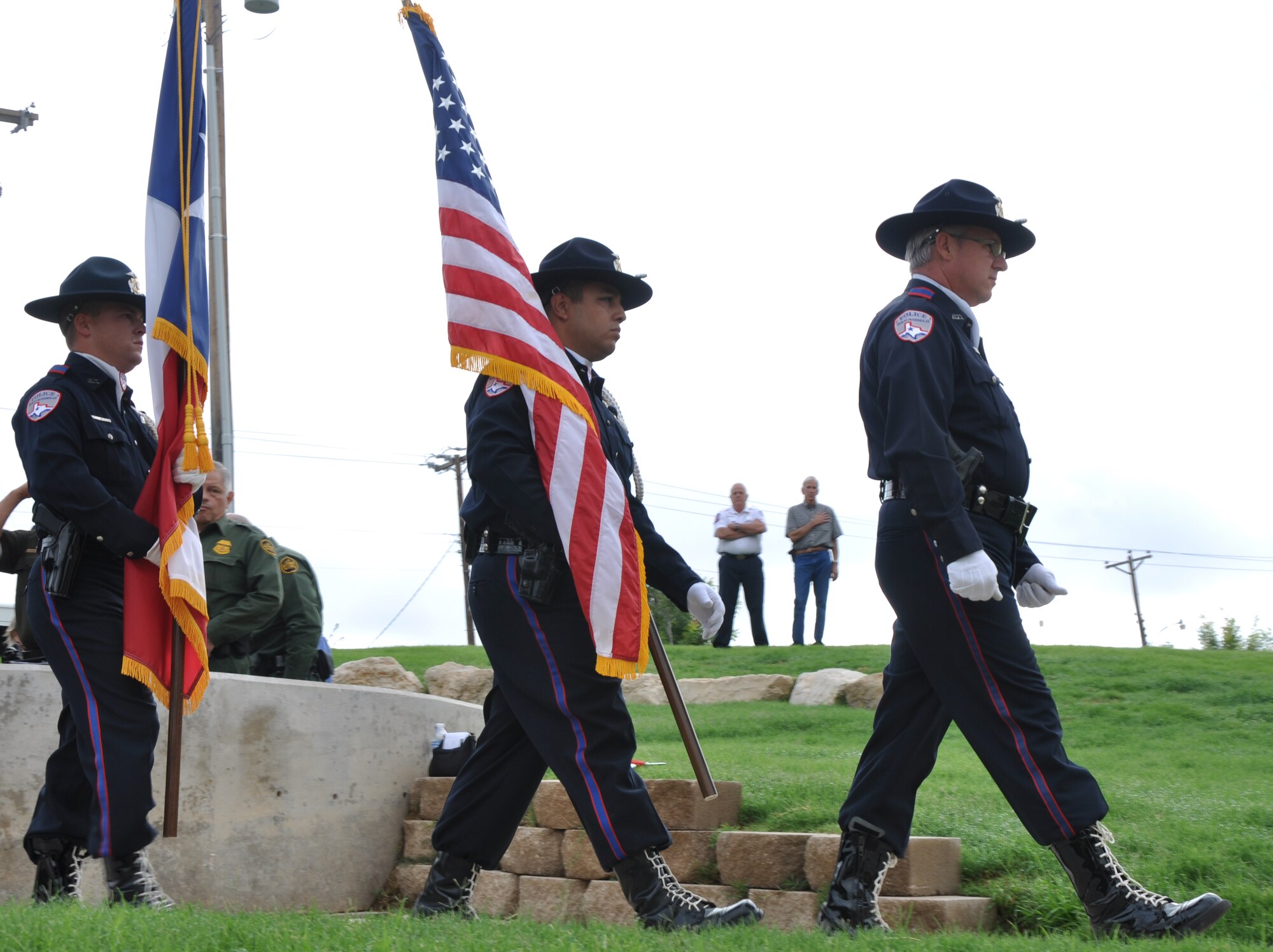 SAN ANGELO, Texas – The San Angelo Police Department Honor Guard retires the colors during a prayer service at the San Angelo 9/11 memorial Sept. 11. The retiring of the colors marked the end of the prayer ceremony honoring the memory of 9/11. (U.S. Air Force photo/ Airman 1st Class Joshua Edwards)