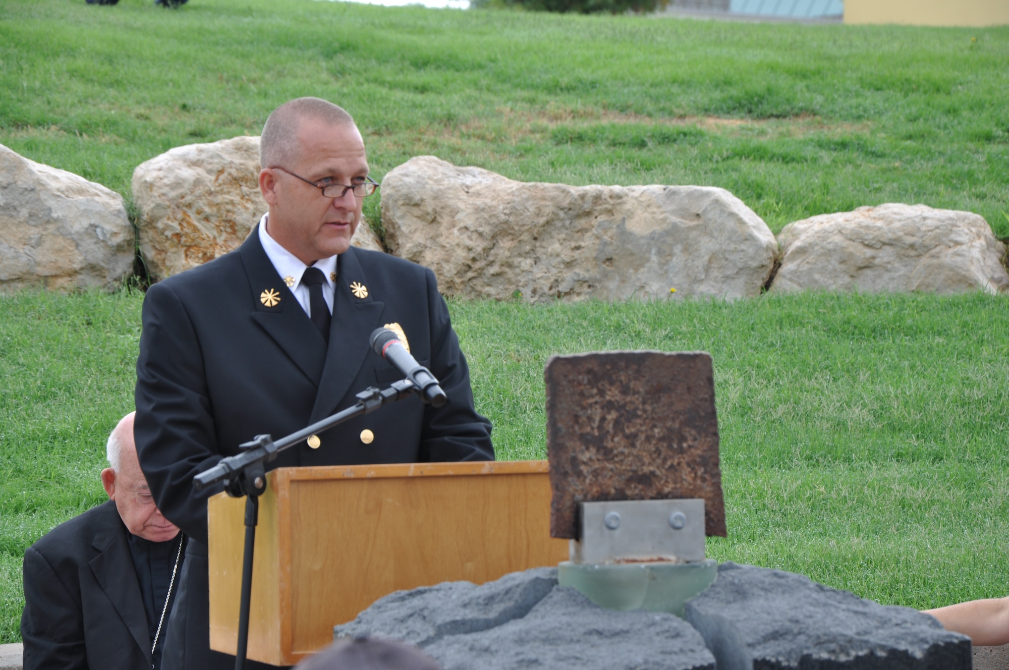 SAN ANGELO, Texas - Scott Farris, San Angelo Fire Department Assistant Chief, speaks about the importance of the firefighter tradition at the San Angelo 9/11 memorial Sept. 11. One of those traditions is ringing the firefighter’s bell in honor of lost firefighters. (U.S. Air Force photo/ Airman 1st Class Joshua Edwards)
