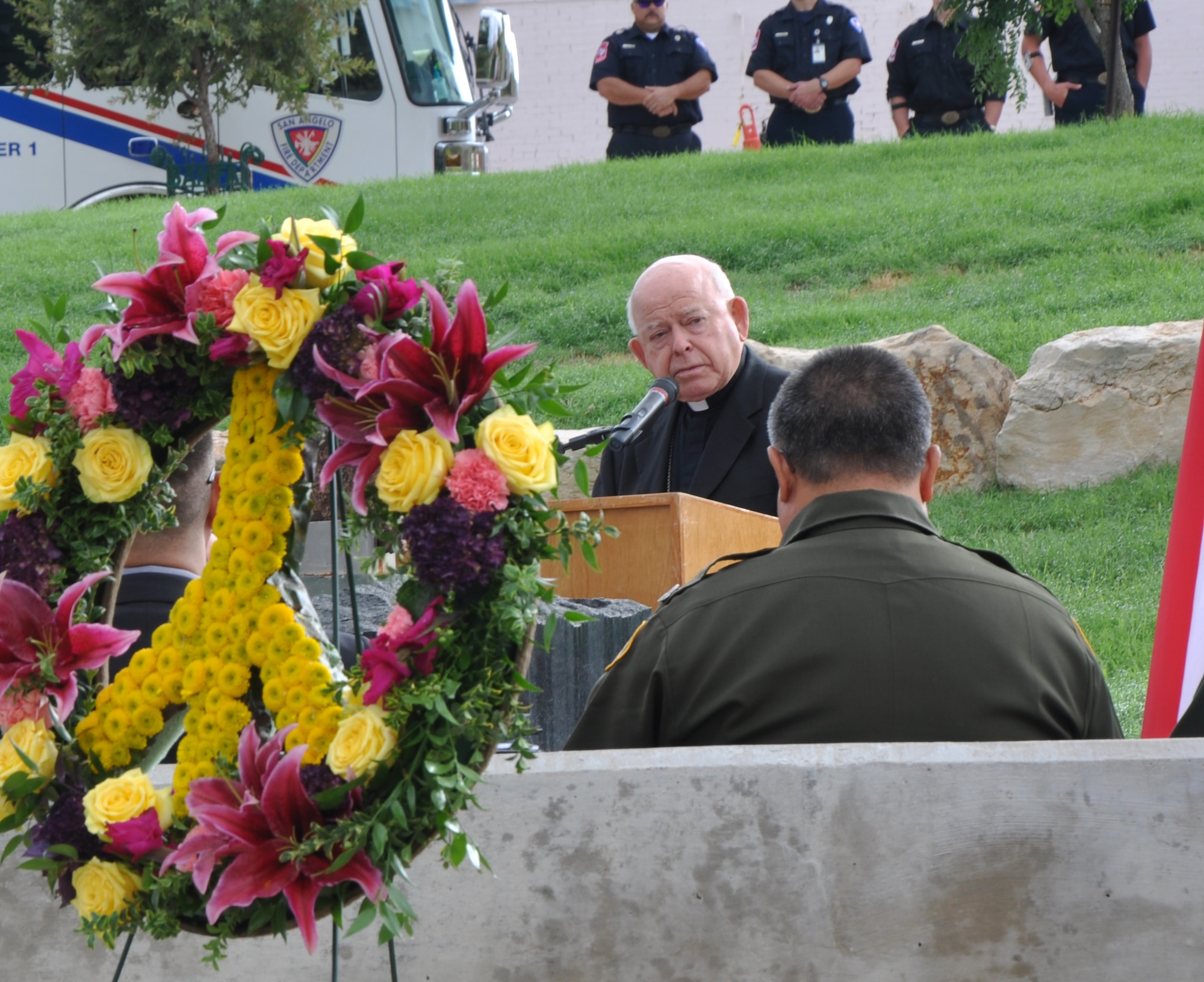 SAN ANGELO, Texas – Michael Pfeifer, San Angelo Bishop of the Diocese, speaks about Sept. 11, 2001, during a prayer service at the San Angelo 9/11 memorial Sept. 11. In his speech, he talked about the loss of life and how United Airlines Flight 93 fought back. (U.S. Air Force photo/ Airman 1st Class Joshua Edwards)