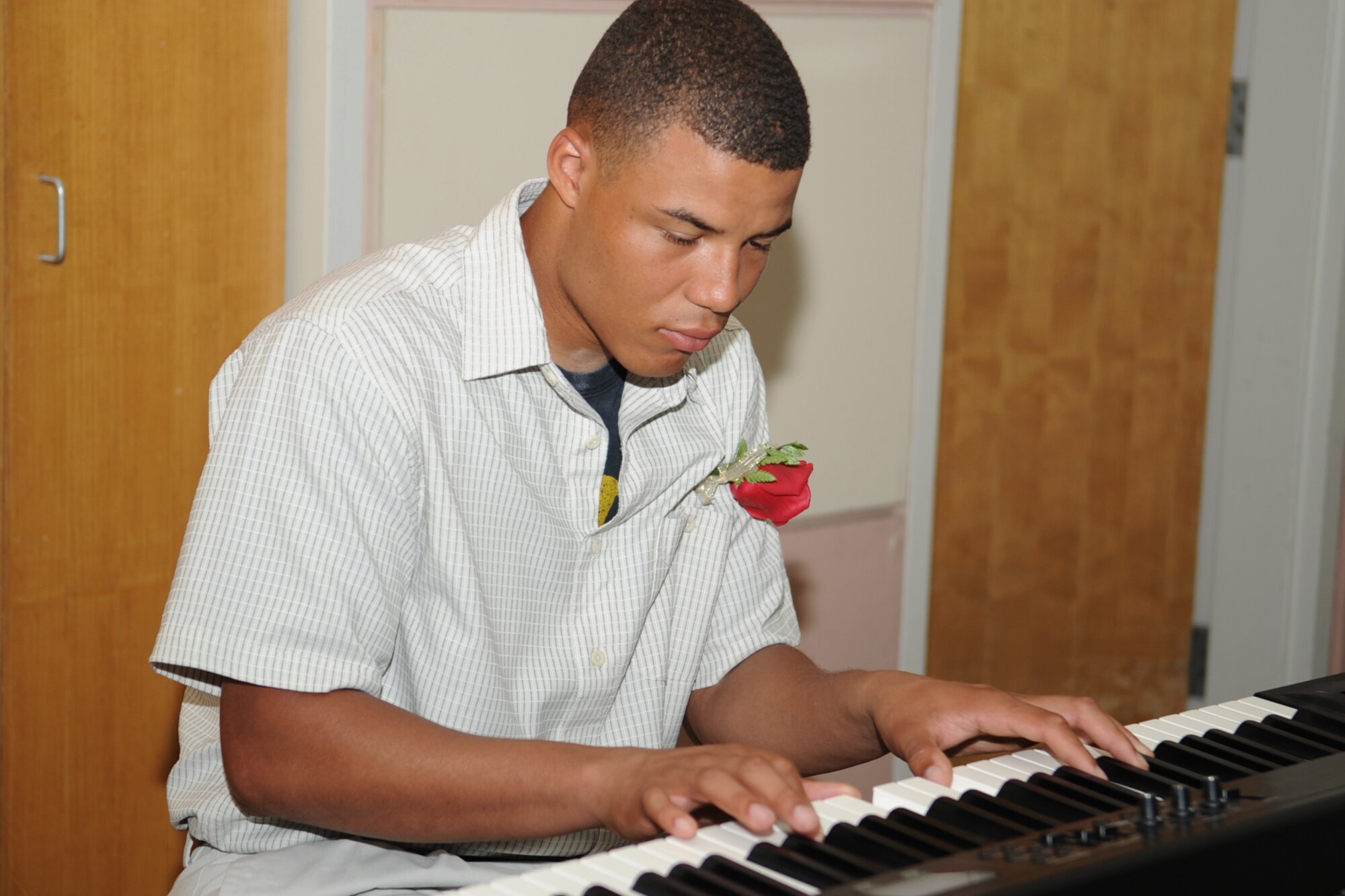GOODFELLOW AIR FORCE BASE, Texas -- Army Pvt. Michael Daniels plays the piano during the MarriageCare Retreat black tie dinner at the Event Center Sept. 7. The dinner was one of the final events of the retreat and was designed to be a romantic dinner for the couples. (U.S. Air Force photo by Staff Sgt. Laura R. McFarlane)