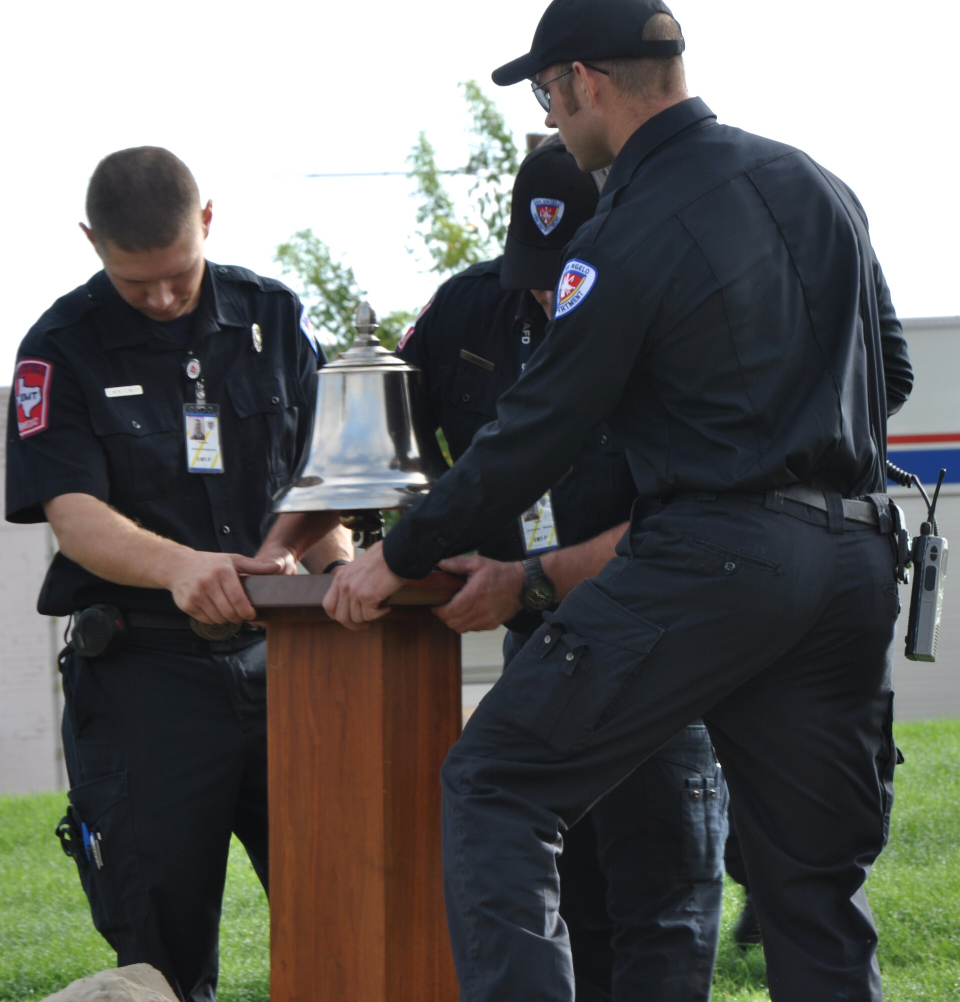 SAN ANGELO, Texas – San Angelo firefighters secure the firemen’s bell in place before a prayer service at the San Angelo 9/11 memorial Sept. 11. One of the firefighters later rang the bell in three sets of three to honor the firefighters of the past. (U.S. Air Force photo/ Airman 1st Class Joshua Edwards)