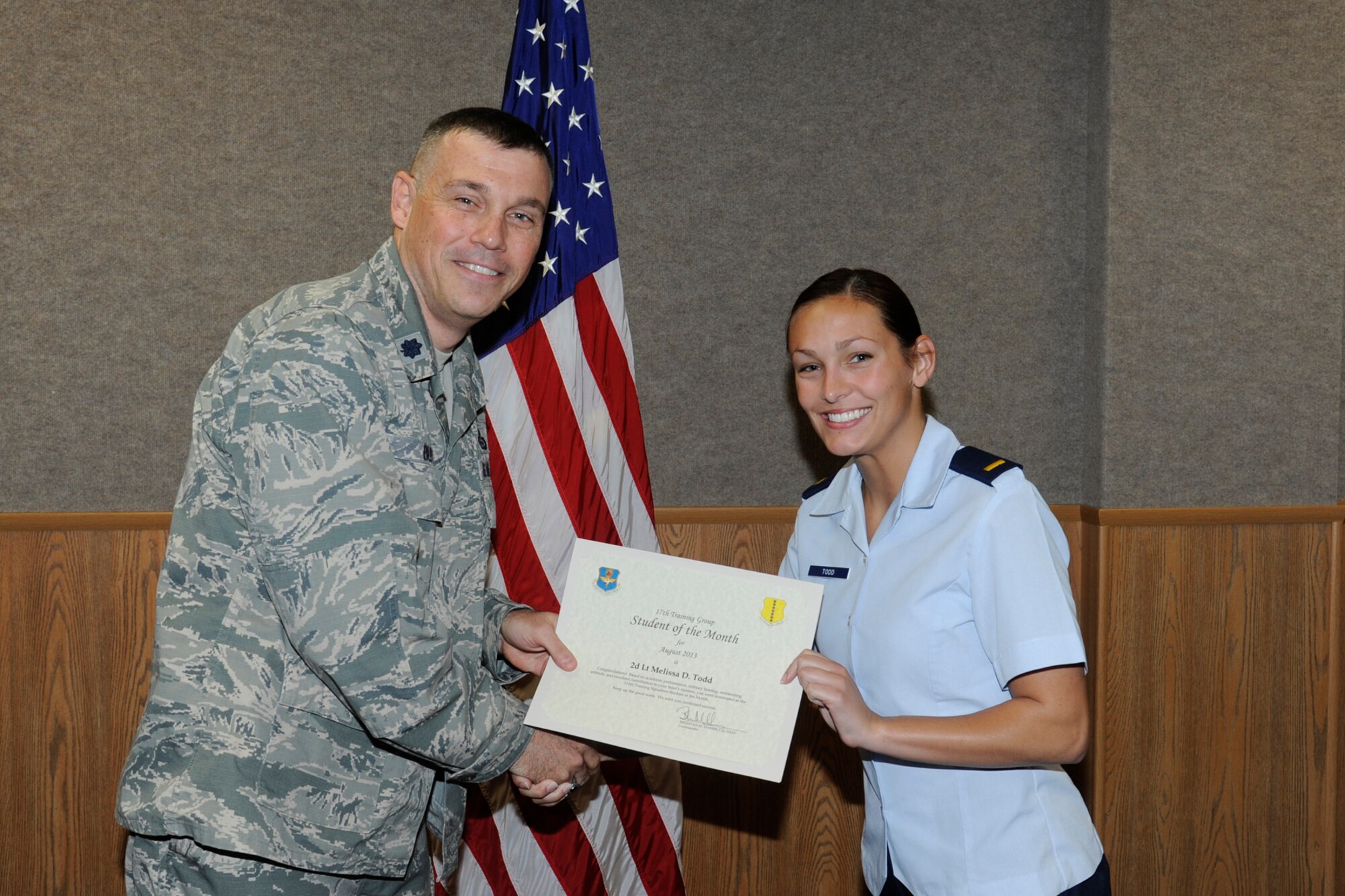 GOODFELLOW AIR FORCE BASE, Texas -- Lt. Col. Edward Blitt, 17th Training Group deputy commander, presents the August 315th Training Squadron Officer Student of the Month award to 2nd Lt. Melissa Todd, Sept. 6. (U.S. Air Force photo by Staff Sgt. Austin Knox)