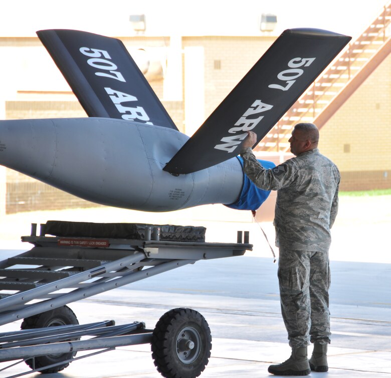 Master Sgt. Travis Fowler, 507th Maintenance Squadron spends a final few moments with a KC-135R he worked on for years.  In the Air Force Reserve many crew chiefs work on an aircraft tail for many years and have a personal vested interest in it. As a result of force structure changes authorized by the National Defense Authorization Act, four KC-135R Stratotanker aircraft flown out of Tinker Air Force Base were relocated this summer with tail number 38880 leaving Aug 30.  The aircraft was operated by the Air Reserve Component Associate Wings consisting of the 507th (Air Force Reserve Command) and the 137th (Oklahoma Air National Guard) Air Refueling Wings.  This aircraft was relocated to Joint Base Pearl Harbor-Hickam to support the Hawaii Air National Guard. (U.S. Air Force Photo/Senior Airman Mark Hybers)