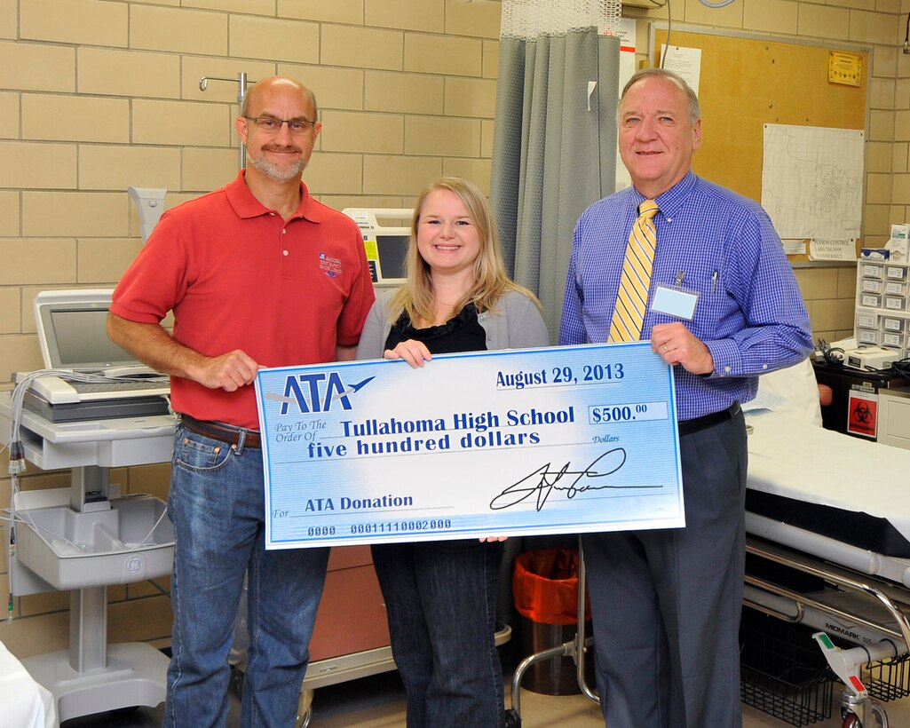 Mark Brandon (left), an Aerospace Testing Alliance (ATA) Instrumentation and Diagnostics Manager, and Leslie Myers (center), a Comprehensive Occupational Resources (CORE) registered nurse (RN) for ATA, present a check to Tullahoma High School (THS) Executive Principal Mike Landis. Brandon was one of 96 AEDC employees who volunteered to donate blood to the Red Cross during the August 19 – 23 blood drive at Arnold Engineering Development Complex (AEDC). To help promote the blood drive, names of ATA personnel who signed up to donate blood were submitted for a random drawing for a $500 donation in the person’s name to the school of their choice. Brandon’s name was drawn and he requested the donation be made to Tullahoma High School.  

According to Myers, coordinator of the blood drives, this is a 35 percent  improvement from the last Red Cross visit in March. ATA General Manager Steve Pearson has announced that ATA will also provide the same $500 incentive program for Blood Assurance’s visit Oct. 22-25. (Photo by Jacqueline Cowan)
