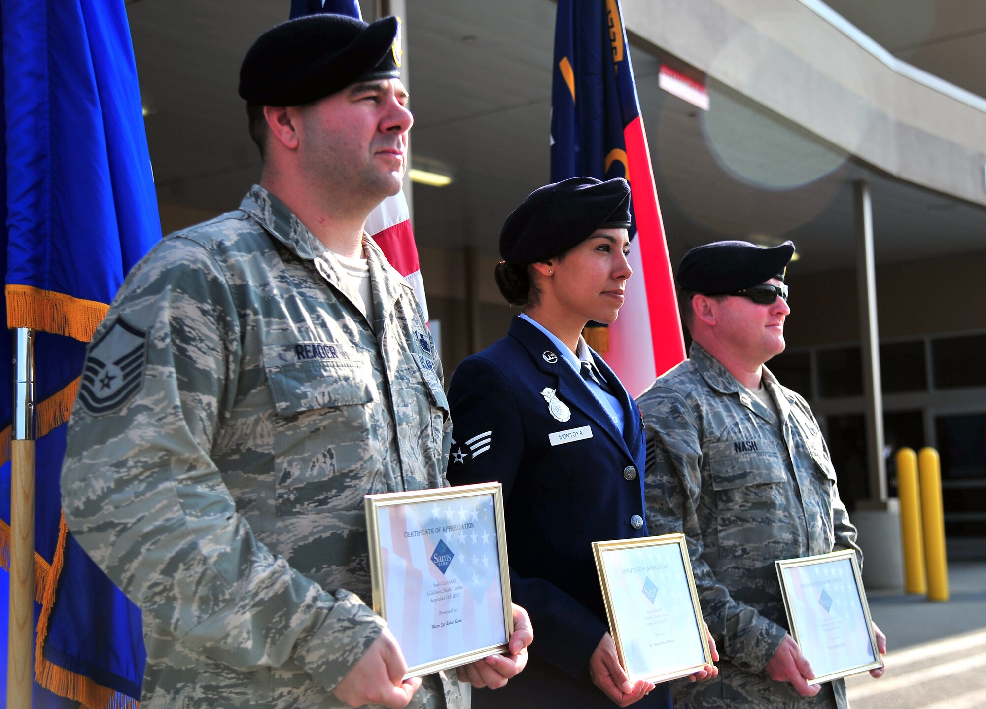 U.S. Air Force Airmen assigned to the 4th Security Forces Squadron display their certificates of recognition they received during a 9/11 memorial ceremony in Goldsboro, N.C., Sept. 11, 2013. The ceremony focused on honoring the efforts of local law enforcement agents who have served the nation since the 9/11 attacks. (U.S. Air Force photo by Senior Airman Aubrey White)