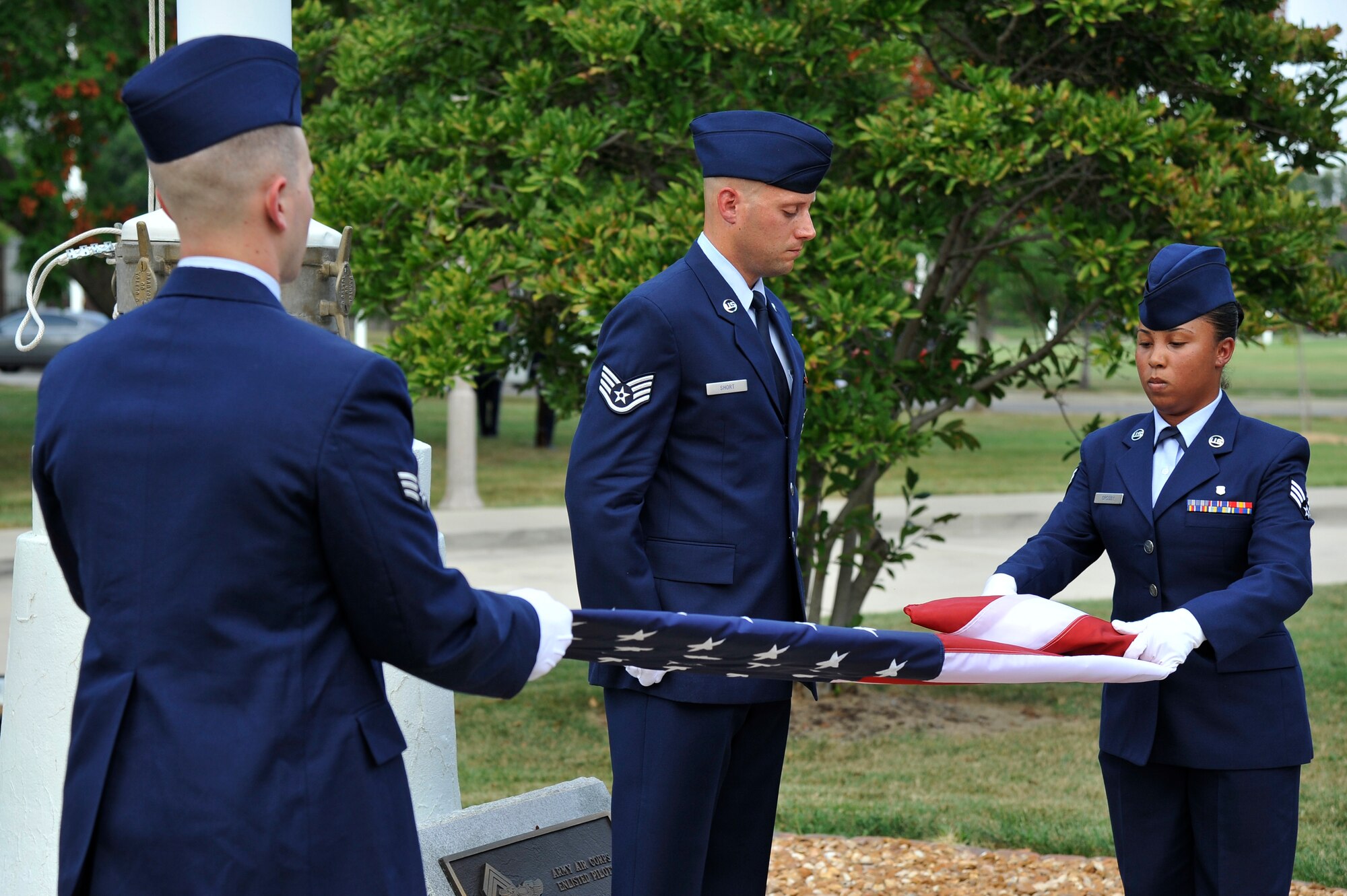 A flag detail folds the flag during a retreat ceremony honoring the victims of the 9/11 terror attacks Sept. 11, 2012, Scott Air Force Base, Ill. The ceremony was held on the twelfth anniversary of the attacks that claimed the lives of 2996 people. (U.S. Air Force photo/Staff Sgt. Christopher Boitz)