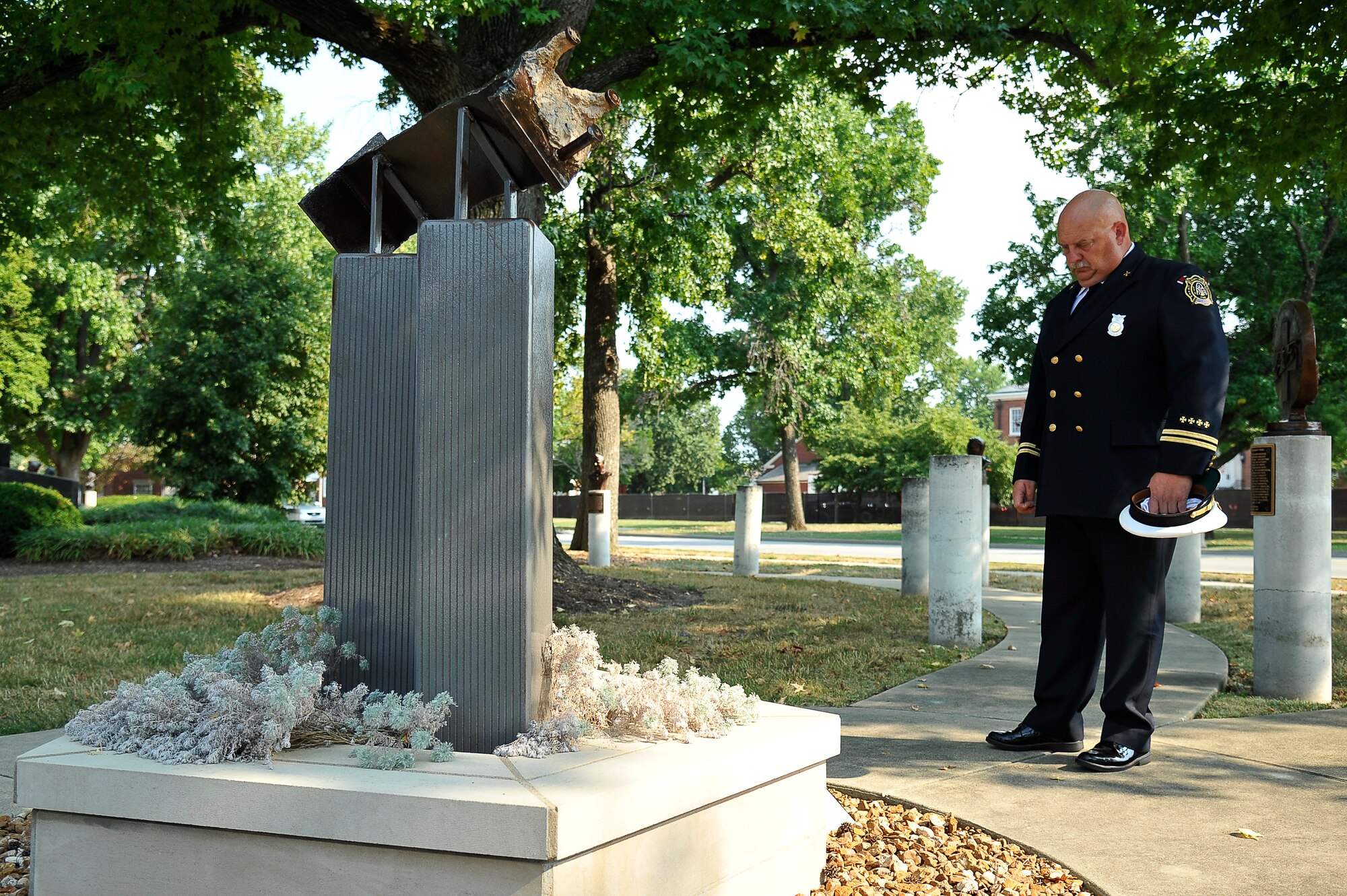 Mike Johnson takes a moment to reflect at the 9/11 memorial on Scott Air Force Base, Ill., Sept. 11, 2013. Johnson is a station chief assigned to the 375 Civil Engineer Squadron fire department. (U.S. Air Force photo/Staff Sgt. Christopher Boitz)