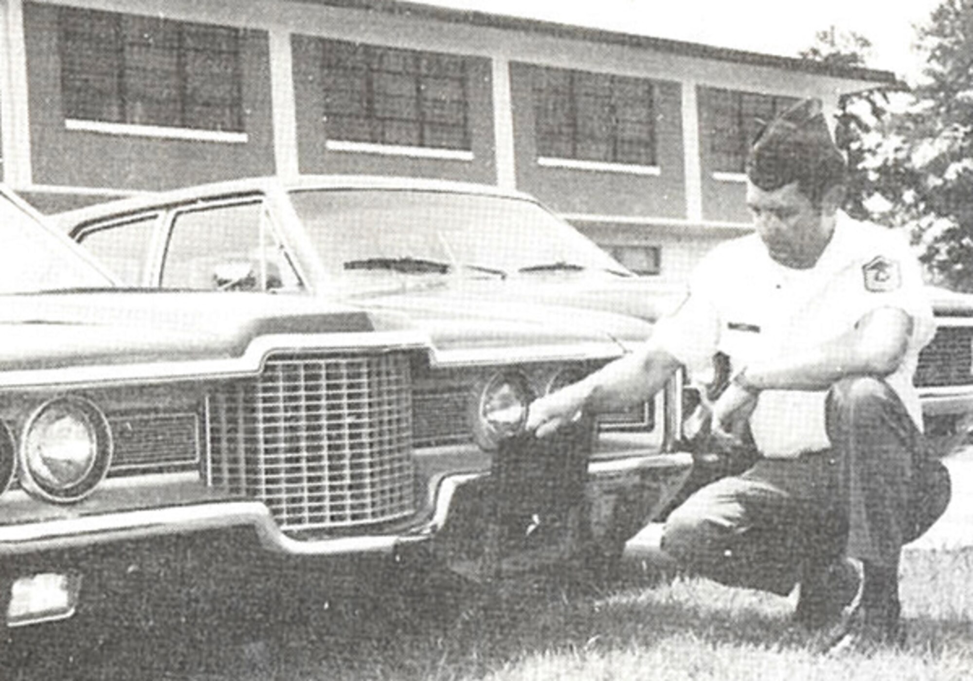 Senior Master Sgt. Ronald E. Durant, 14th AF transportation supervisor, inspects the base commander’s staff car, Sept. 1980. With 100,000 miles on the odometer and still going strong, the 1970 vehicle, assigned to Brig. Gen. James E. McAdoo, 14th Air Force commander, was held on Dobbins Air Force Base, Ga. for over ten years. (U.S. Air Force photo/Tech. Sgt. Rick Ross, published Sept. 1980)