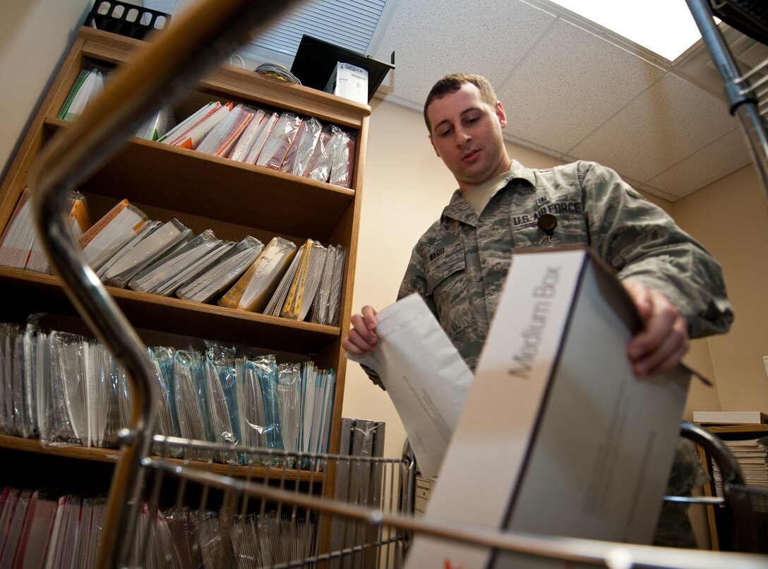 Airman 1st Class Nicholas Ward, 28th Medical Support Squadron medical records technician, prepares records for shipment at Ellsworth Air Force Base, S.D., Sept. 6, 2013. After two years of inactivity, records are retired and shipped to the national archive at Randolph AFB, Texas. (U.S. Air Force photo by Airman 1st Class Alystria Maurer/Released)
