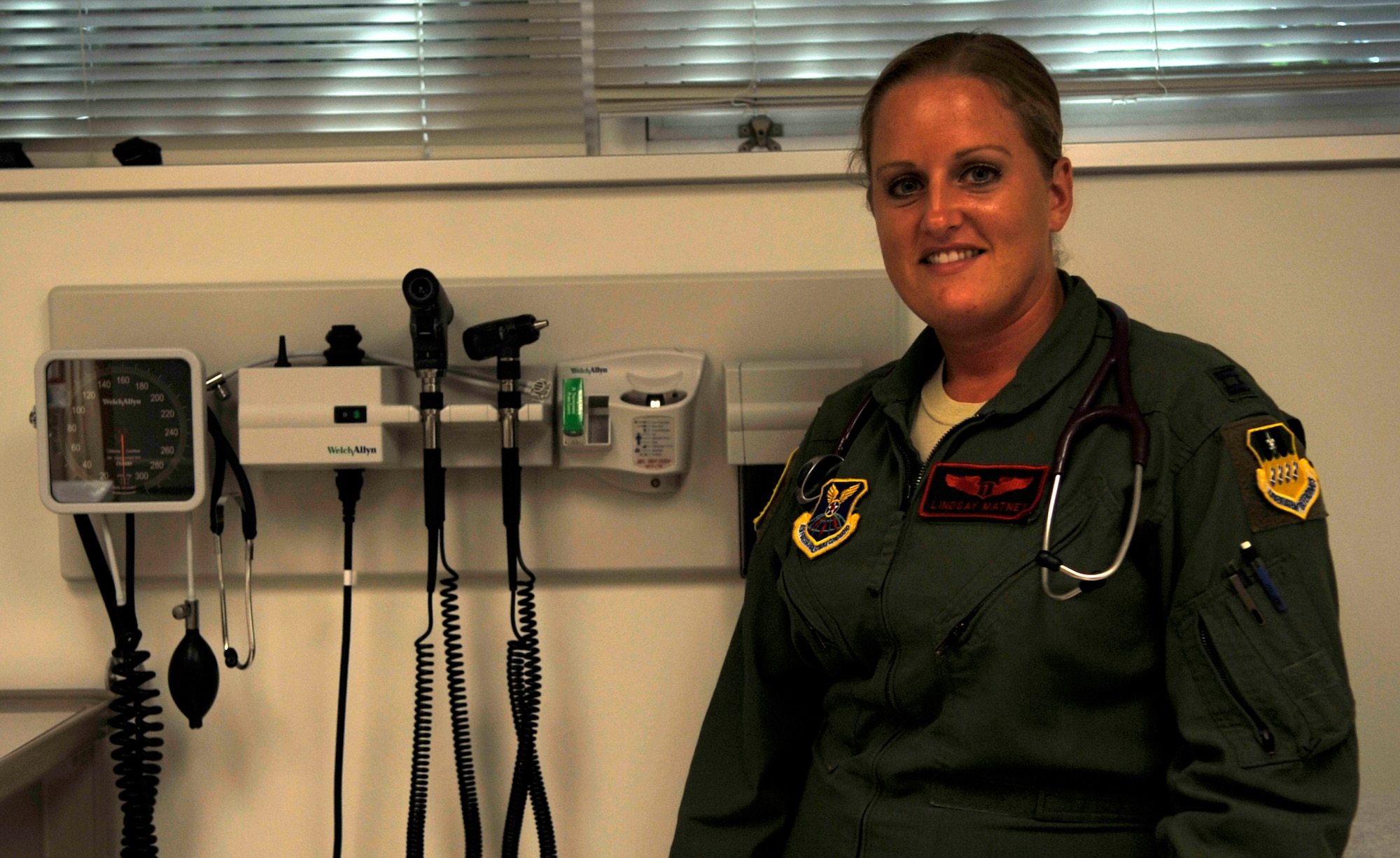 Capt. Lindsay Matney, 96th Bomb Squadron flight surgeon, poses for a photo in the 2nd Medical Group on Barksdale Air Force Base, Sept. 9, 2013. During a medical crisis onboard an aircraft returning from a deployment, March, Matney saved the life of a flight attendant, and was awarded an Air Force Commendation Medal. (U.S. Air Force photo/Airman 1st Class Benjamin Raughton)