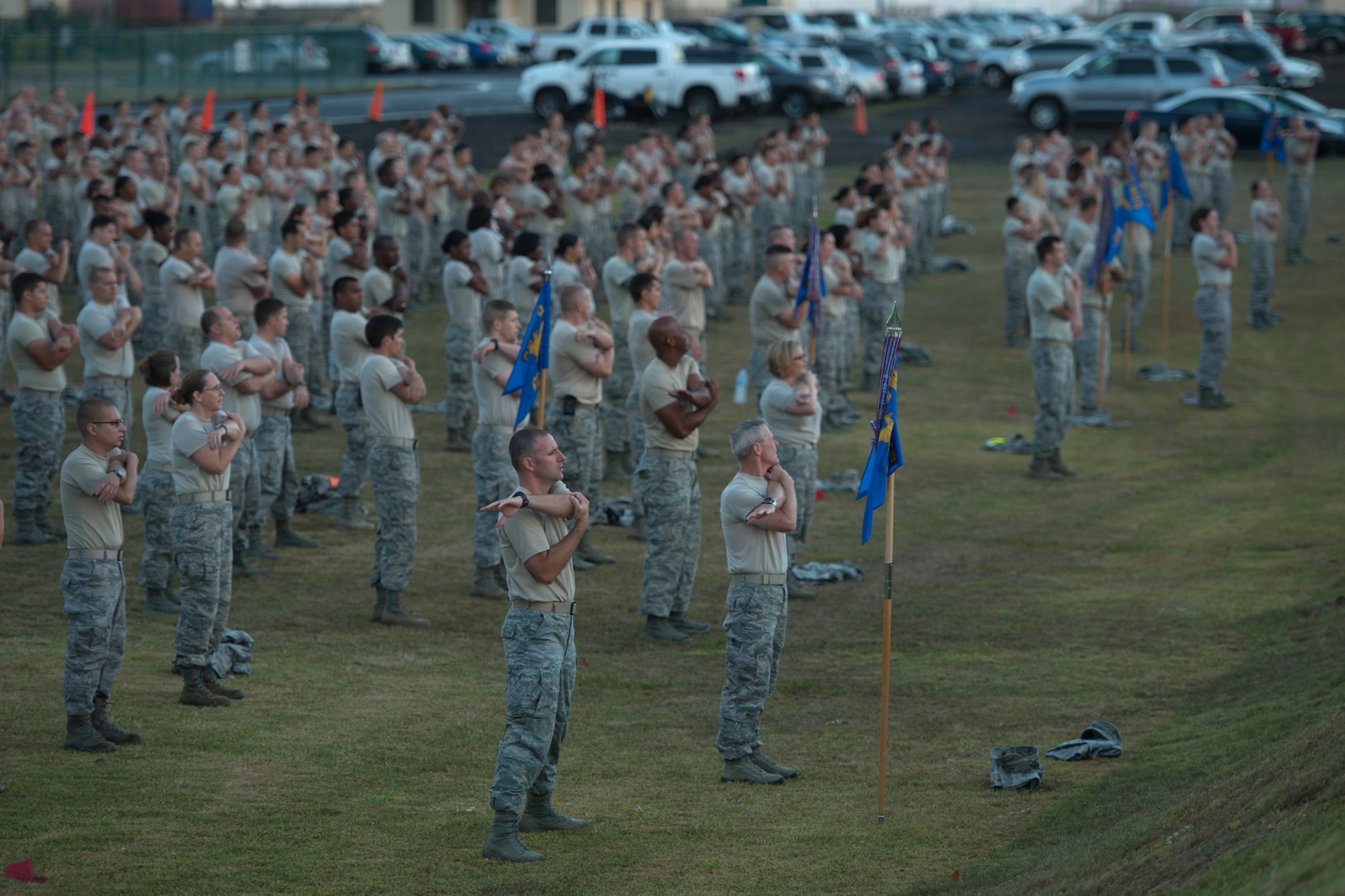 U.S. Air Force Airmen from the 65th Air Base Wing stretch before a 9/11 formation run Sept. 11, 2013, at Lajes Field, Azores. The 65th Air Base Wing honored those killed on 9/11 with a “boots and utes” memorial run that was led by Lajes Airmen first responders. (U.S. Air Force photo by Tech. Sgt. Paul Villanueva II/Released)