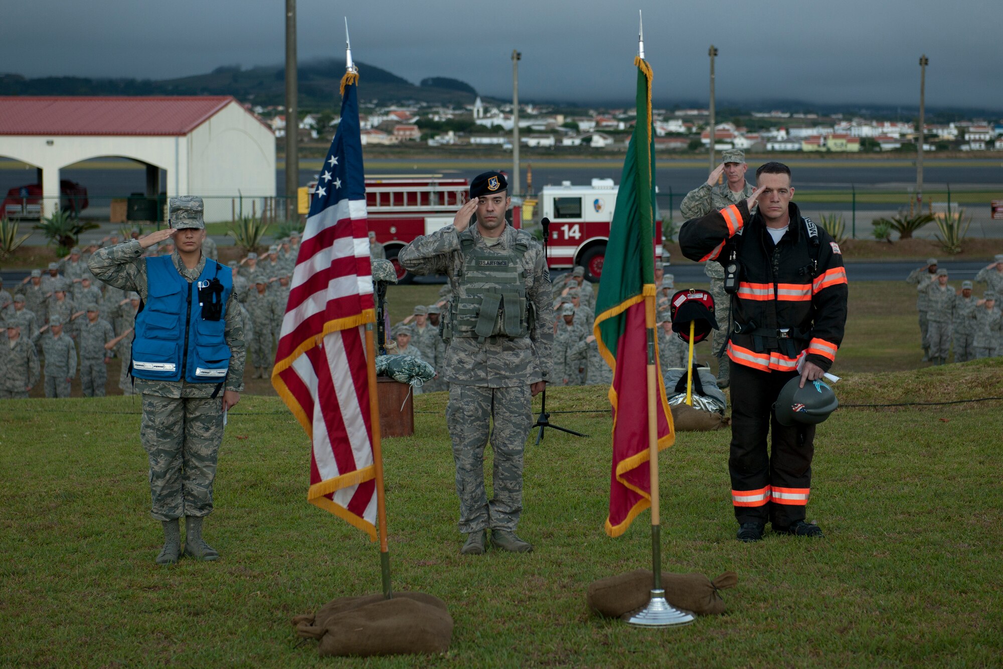 From left, U.S. Air Force Senior Airman Hannah Meza, 65th Medical Operations Squadron medical technician, Staff Sgt. Zackery Vaught, 65th Security Forces Squadron security forces specialist, and Staff Sgt. Andrew Kose, 65th Civil Engineer Squadron firefighter, honor those killed on 9/11 during a remembrance ceremony Sept. 11, 2013, at Lajes Field, Azores. The first responders led the 65th Air Base Wing in a “boots and utes” memorial run. (U.S. Air Force photo by Tech. Sgt. Paul Villanueva II/Released)