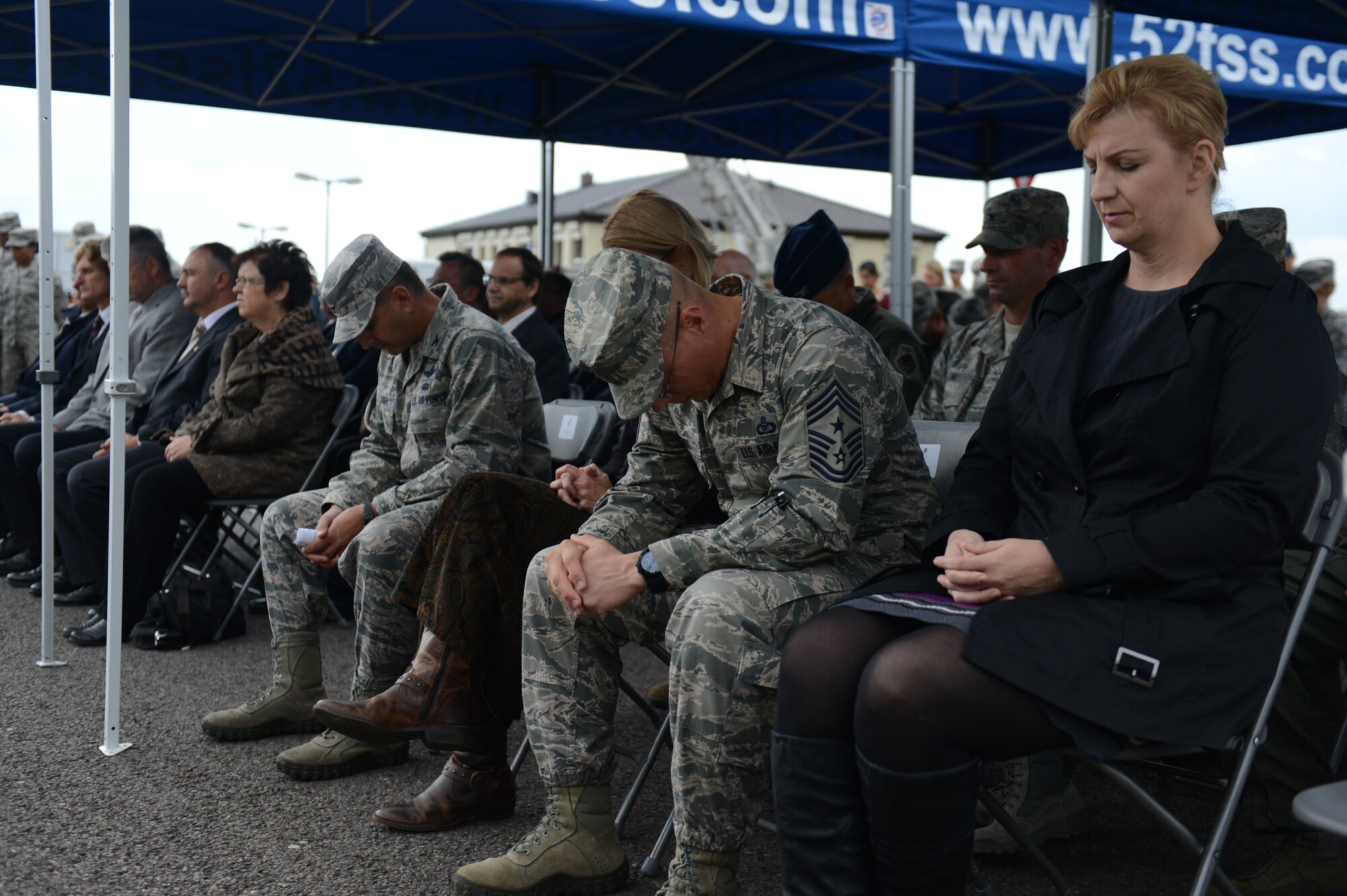 SPANGDAHLEM AIR BASE, Germany – Members of the Spangdahlem community take a moment during a 9/11 commemorative ceremony Sept. 11, 2013, to remember those who lost their lives. The ceremony included a prayer, poem reading and remembrance of the attack that occurred 12 years ago. (U.S. Air Force photo by Airman 1st Class Gustavo Castillo/Released) 