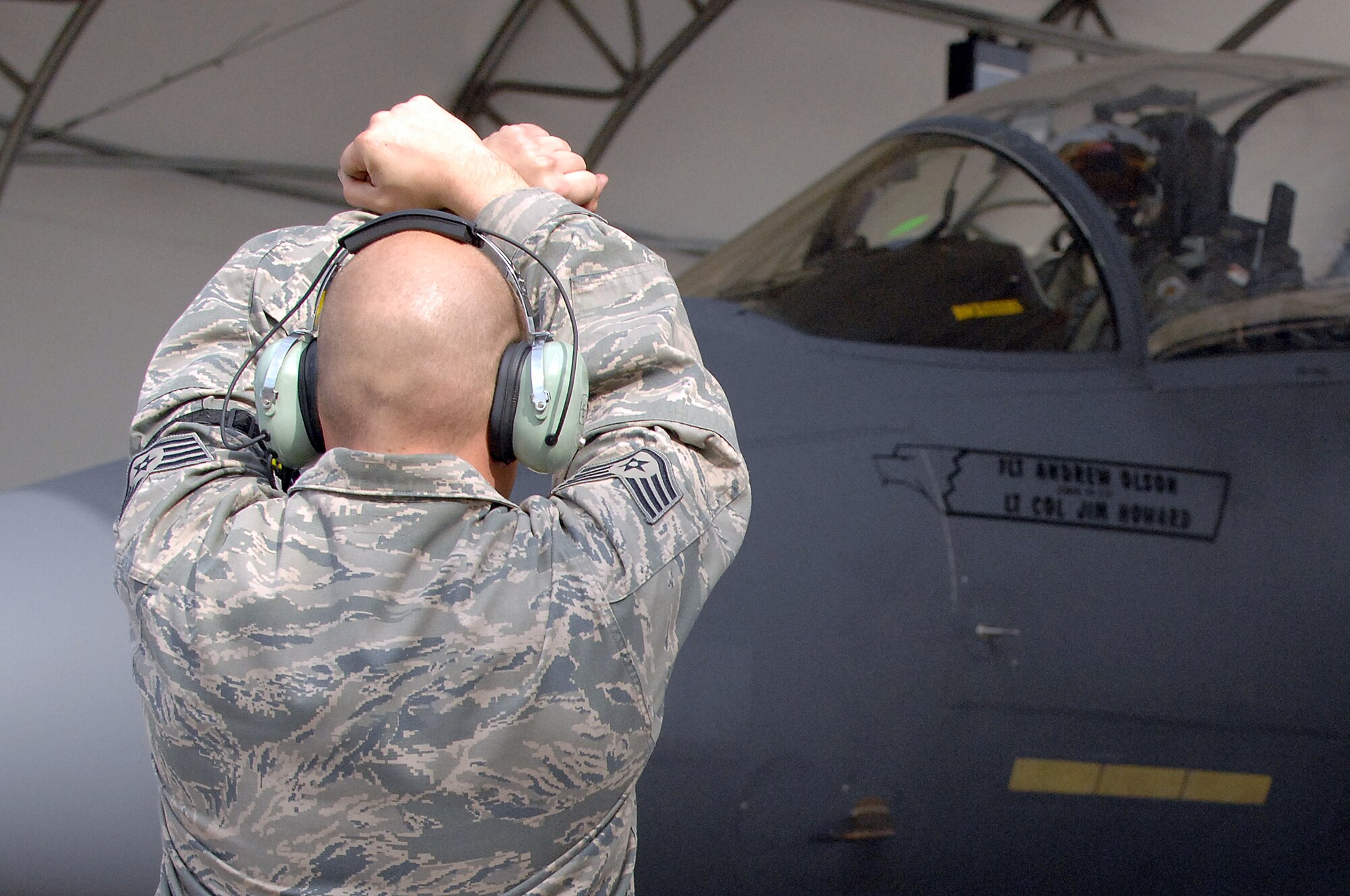 U.S. Air Force Staff Sgt. Michael Wray, 4th Aircraft Maintenance Squadron crew chief, marshals an F-15E Strike Eagle during exercise RAZOR TALON at Seymour Johnson Air Force Base, N.C., Sept. 6, 2013.  RAZOR TALON, a monthly joint-force exercise that combines resources from multiple installations across the East Coast, is designed to integrate air, land and sea forces to promote a more cohesive atmosphere between the different military services.  (U.S. Air Force photo by Airman 1st Class Brittain Crolley)