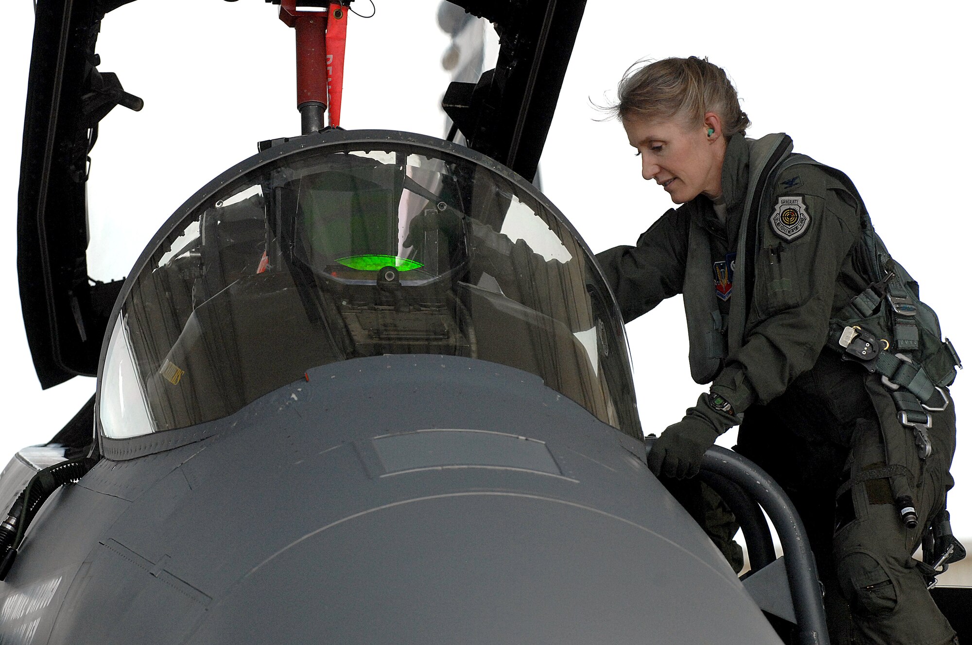 U.S. Air Force Col. Jeannie Leavitt, 4th Fighter Wing commander, climbs into an F-15E Strike Eagle in preparation for exercise RAZOR TALON at Seymour Johnson Air Force Base, N.C., Sept. 6, 2013.  The 4th FW regularly participates in RAZOR TALON, a monthly joint-force exercise that combines resources from multiple installations across the East Coast, to interact with and build synergy with other services.  (U.S. Air Force photo by Airman 1st Class Brittain Crolley)