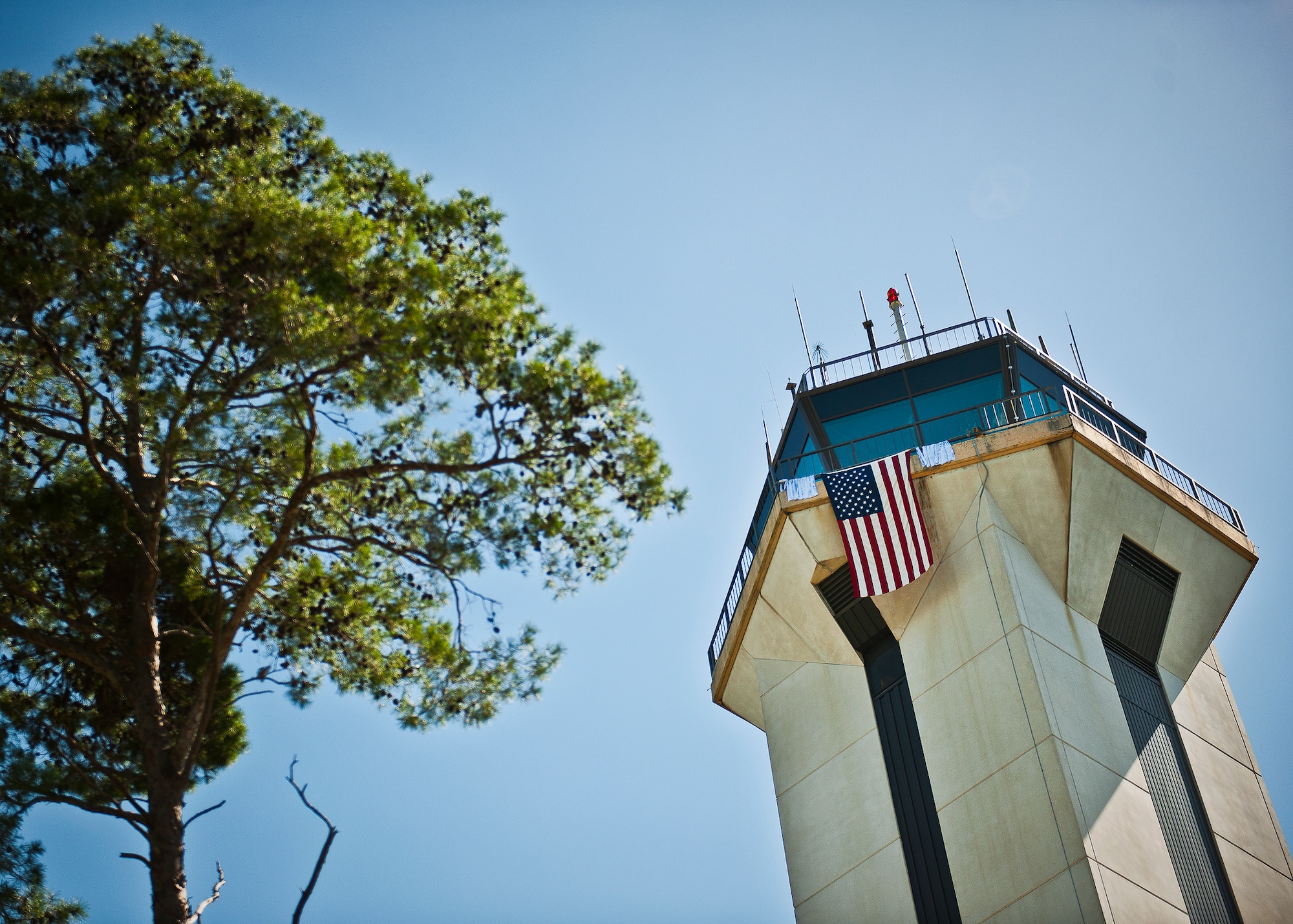 An American Flag and the names of the 343 firefighters killed Sept. 11 2001 hang over the side of the Eglin Air Force Base air traffic control tower Sept. 11.  Fire department Airmen and civilians ascended the 11-story air traffic control tower multiple times to deliver ribbons to the top.  When each name was delivered, it was read aloud.  (U.S. Air Force photo/Samuel King Jr.)