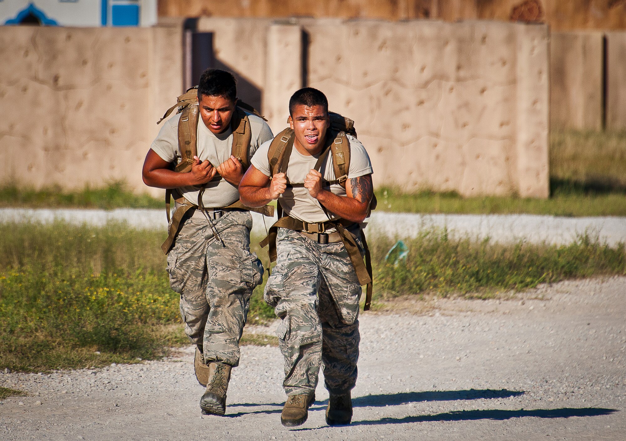 Airmen sprint toward the finish line of the Fallen Defender Ruck March Sept. 11 at Eglin Air Force Base, Fla.  More than 200 people came out to walk or run the 4-mile trail and pay respect to fallen security forces Airmen along the way.  (U.S. Air Force photo/Samuel King Jr.)