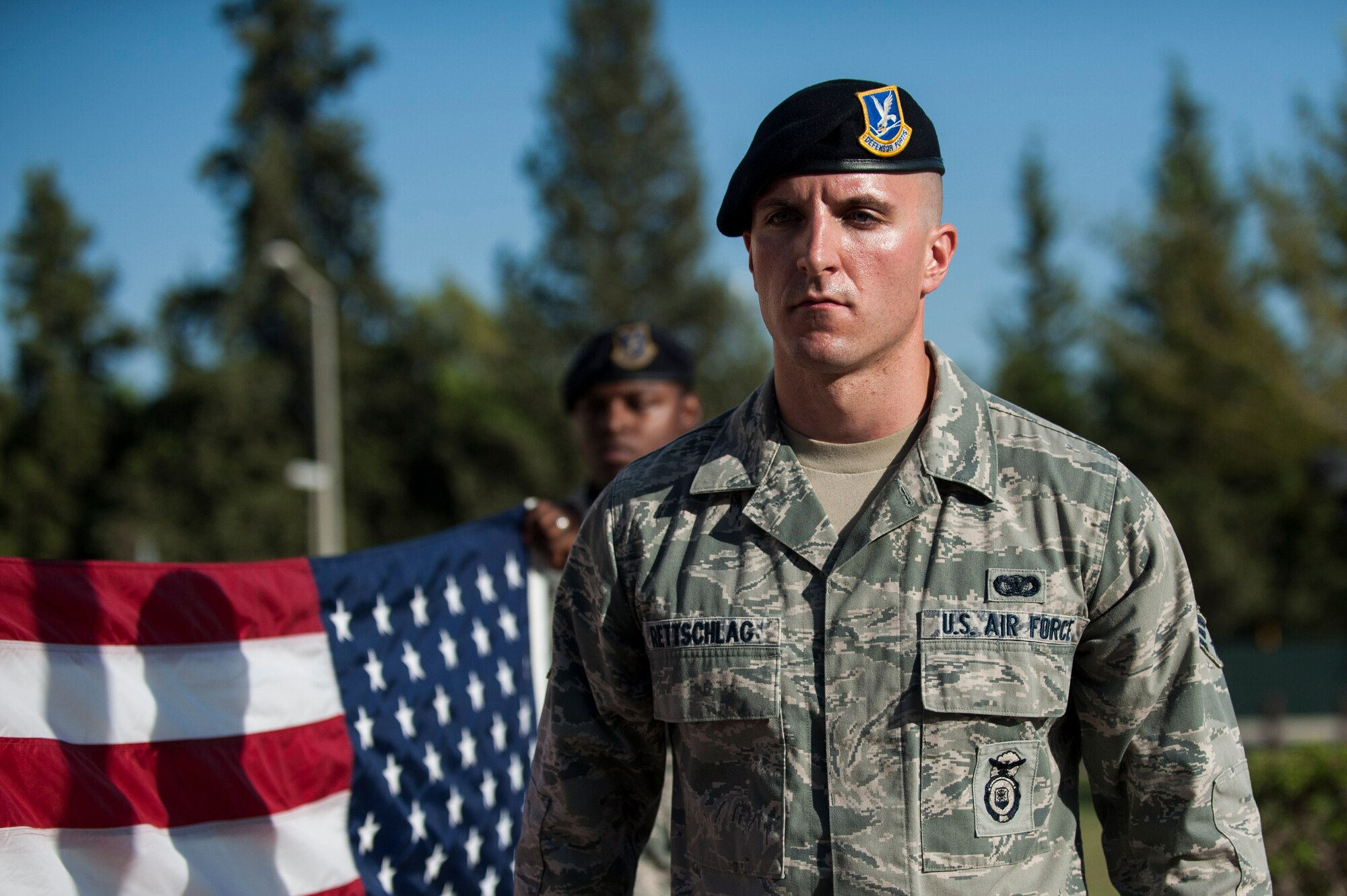 Senior Airman Joshua Rettschlag, 39th Security Forces Squadron patrolman, assists in a flag-fold during the 9/11 Retreat Ceremony Sept. 11, 2013, at Incirlik Air Base, Turkey. The event was held in honor of those who lost their lives during the Sept. 11 terrorist attacks.  (U.S. Air Force photo by Airman 1st Class Nicole Sikorski/Released)